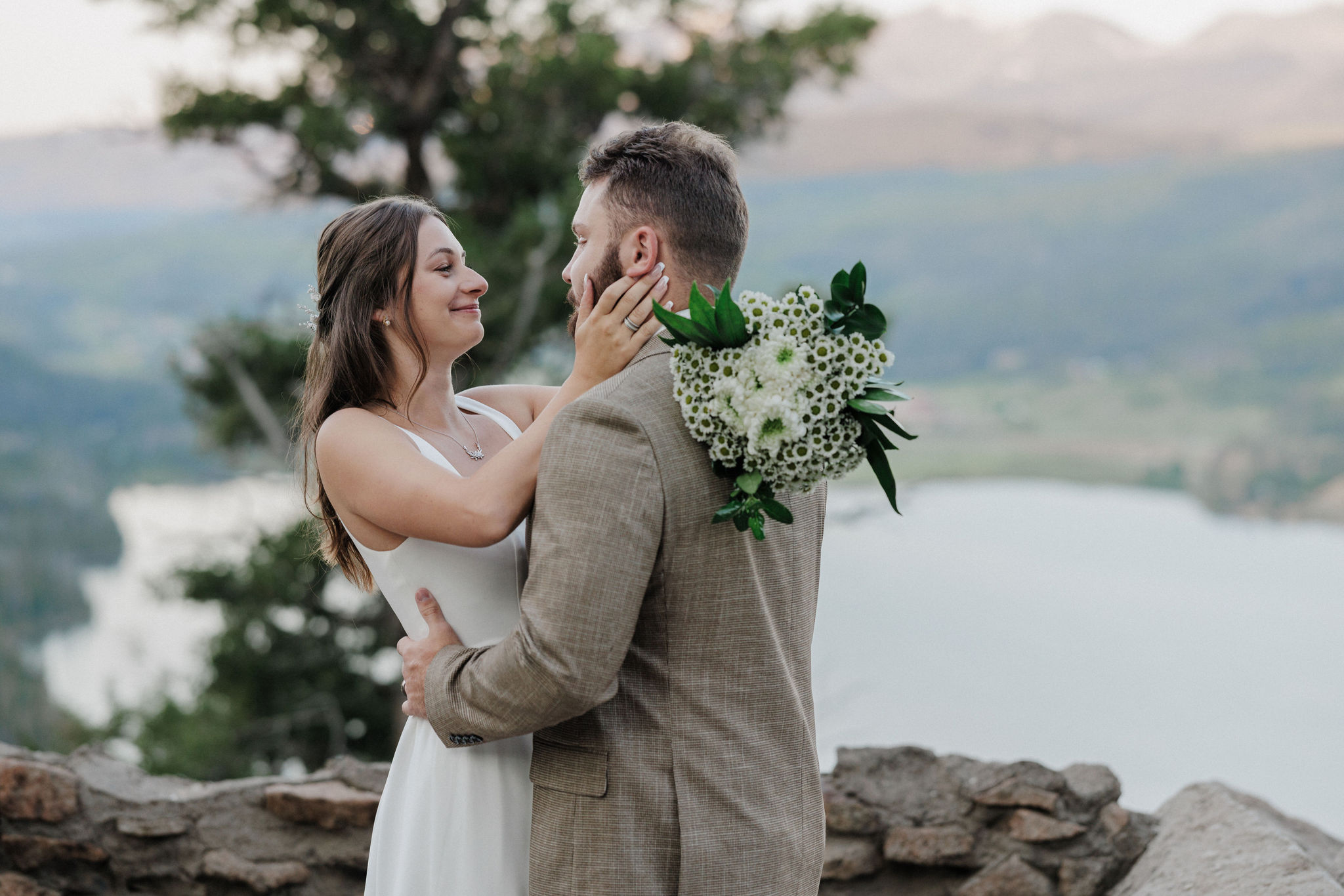 bride and groom smile as they pose for colorado wedding photos