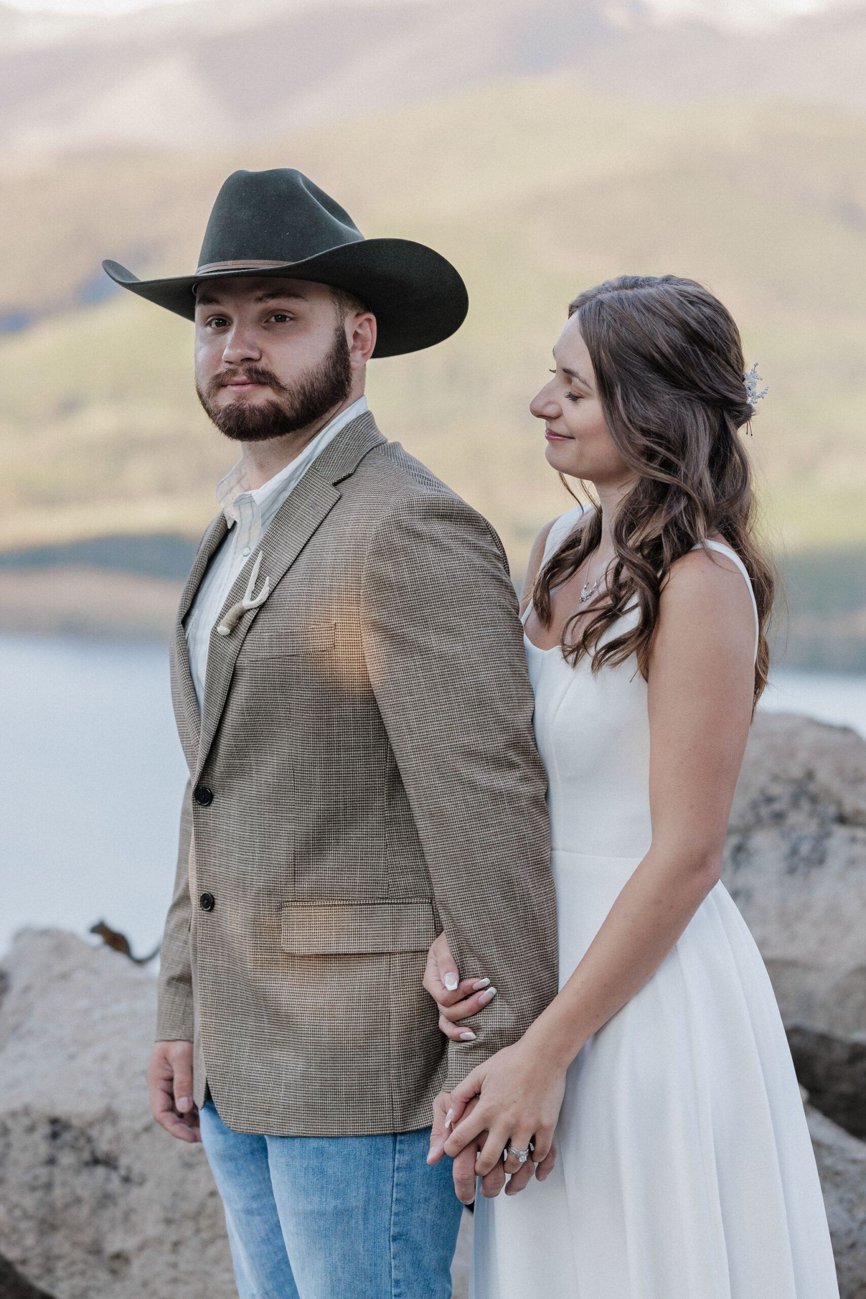 bride and groom pose for colorado elopement photographer