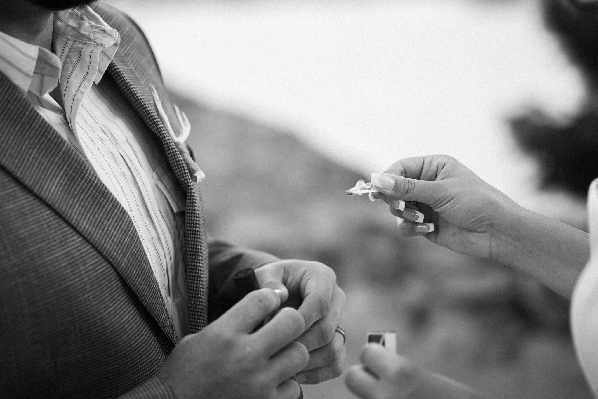 bride lights match for grooms cigar