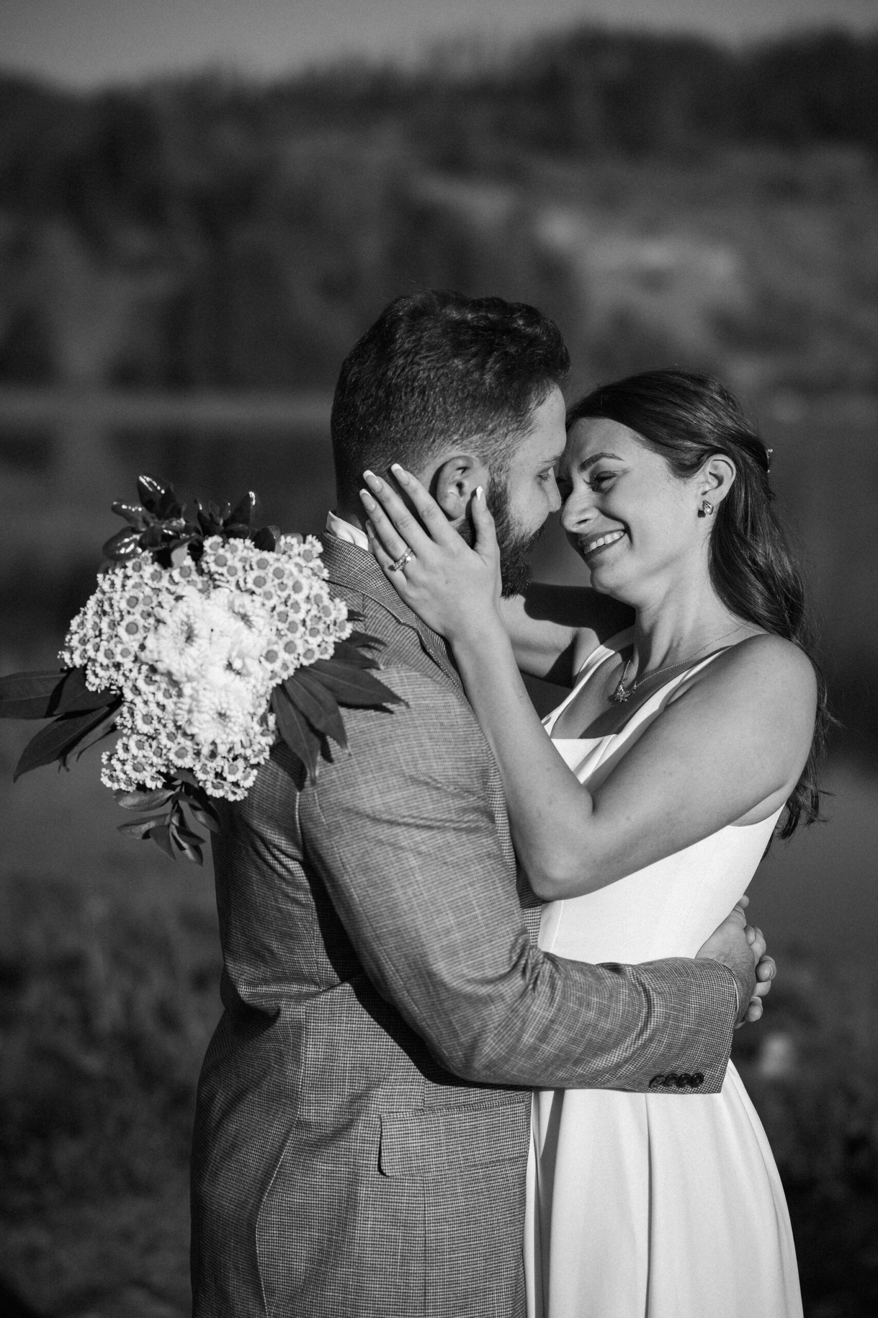 bride and groom pose for colorado photographer during sunrise elopement ceremony