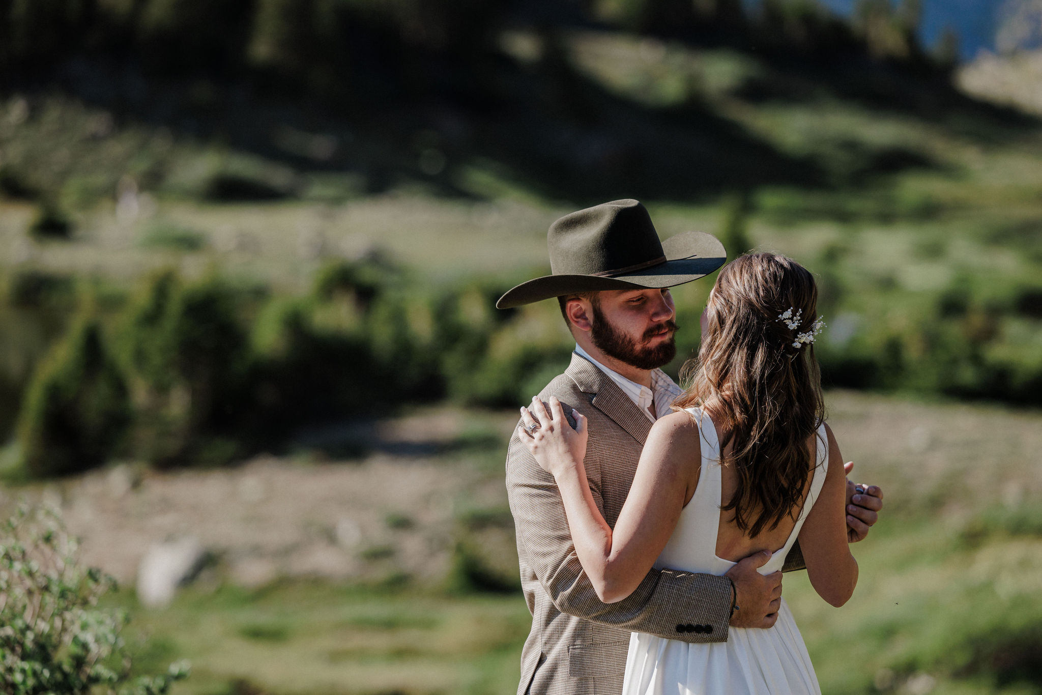 bride and groom hold each other during sunrise colorado elopement