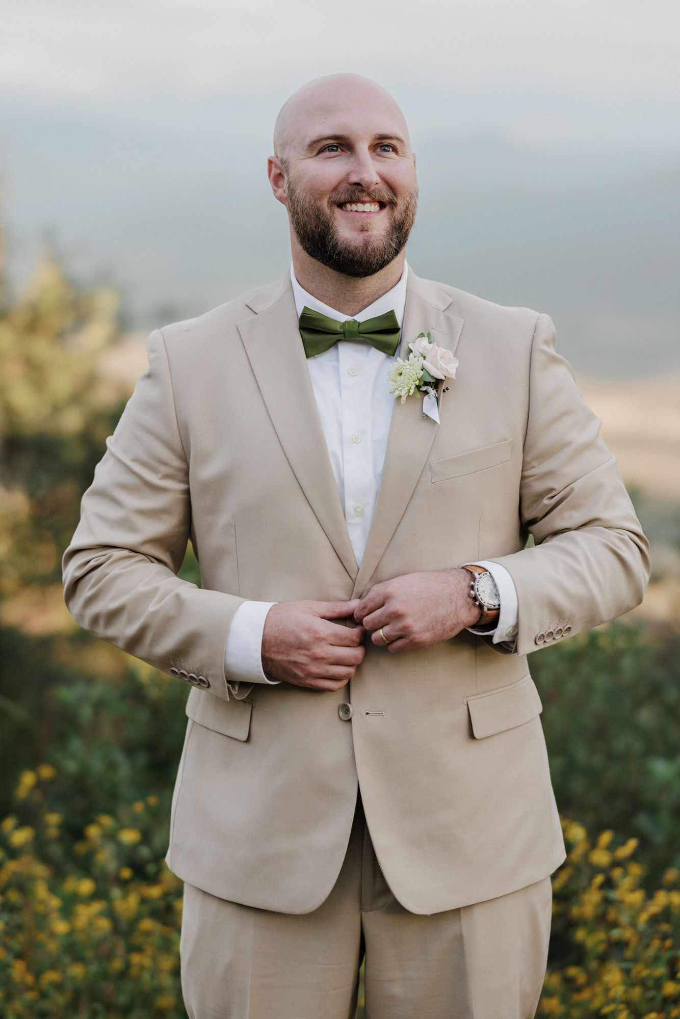 groom poses during wedding portraits