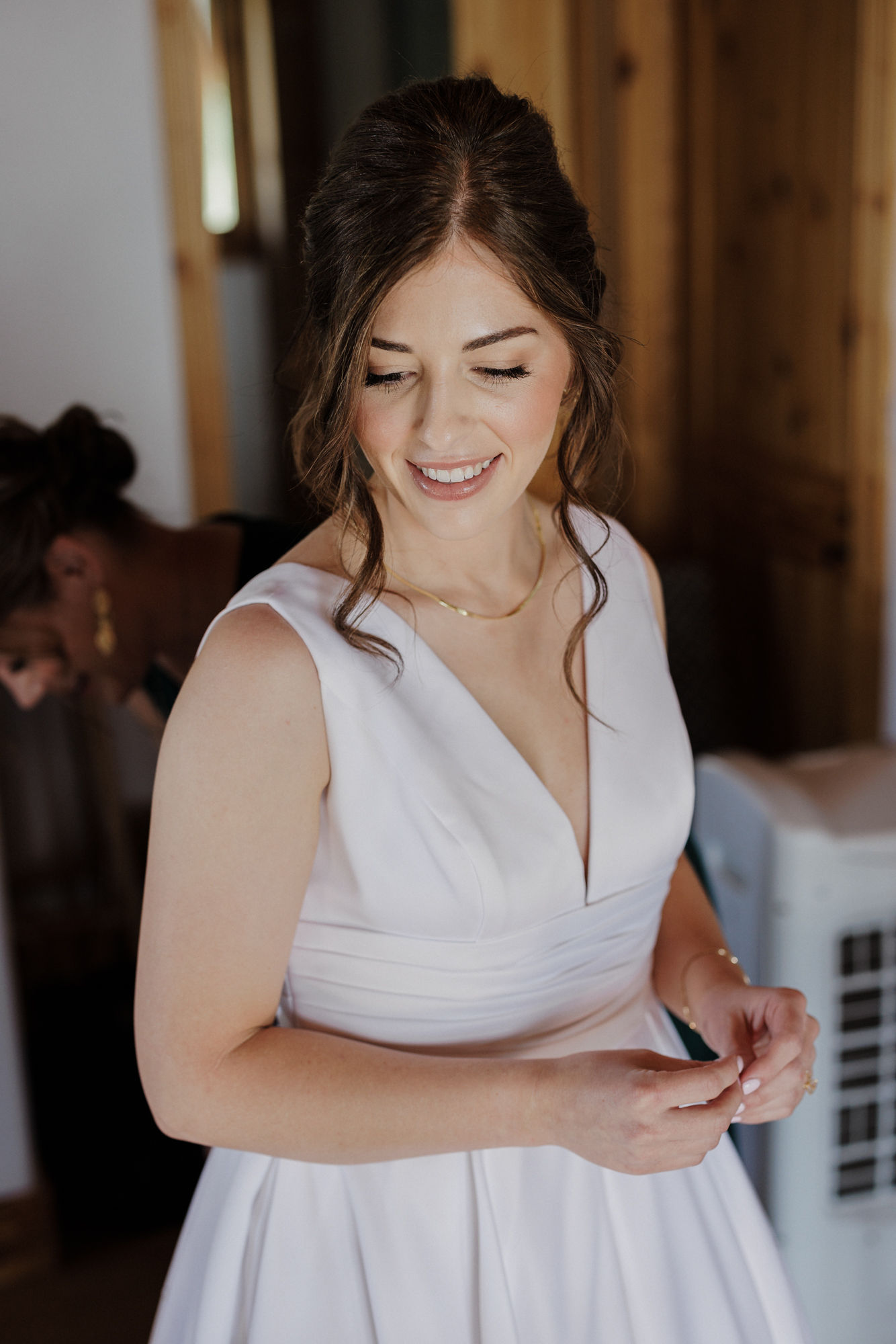 bride poses for colorado wedding photographer while getting ready for micro wedding