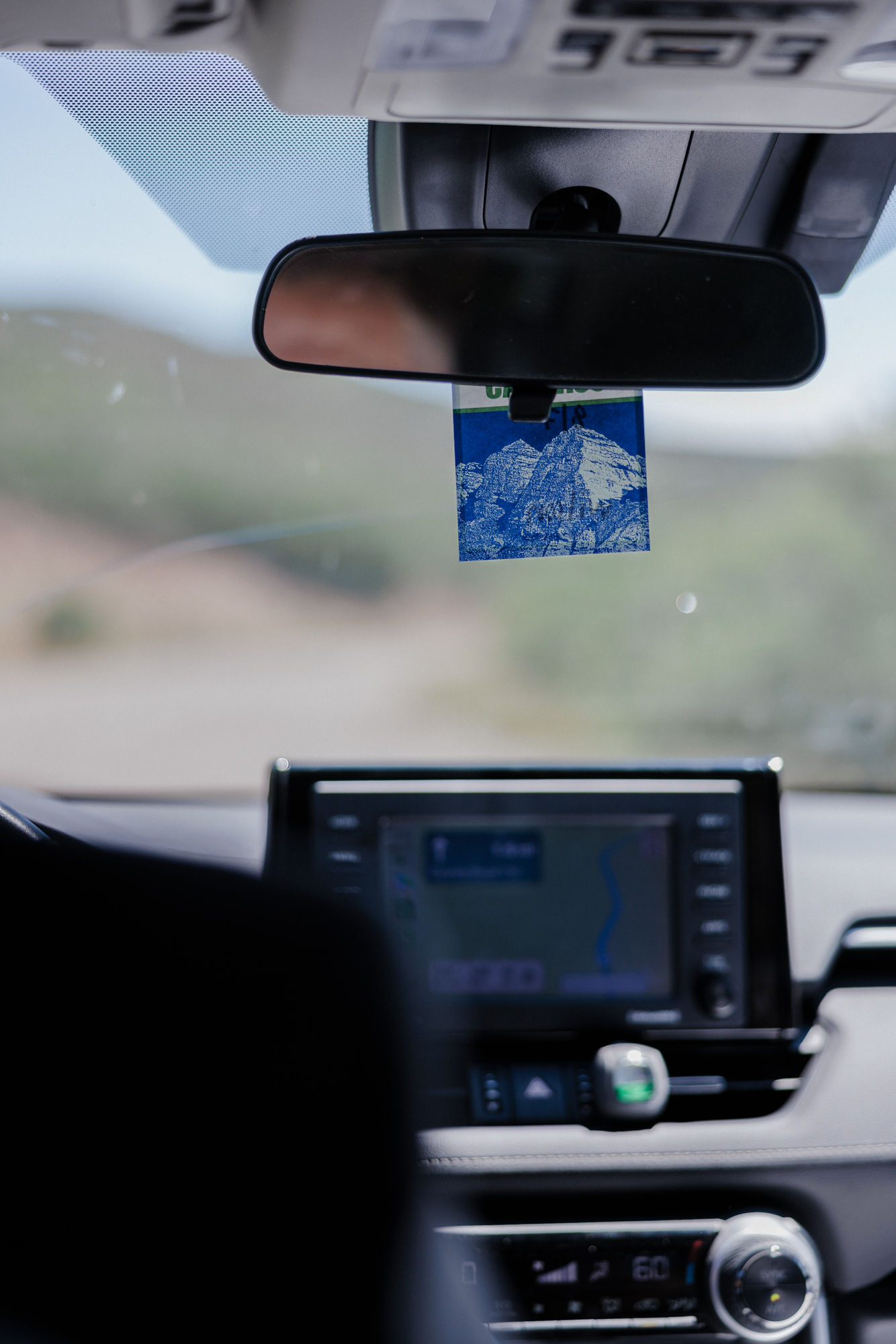 image of car driving on a dirt road in aspen colorado