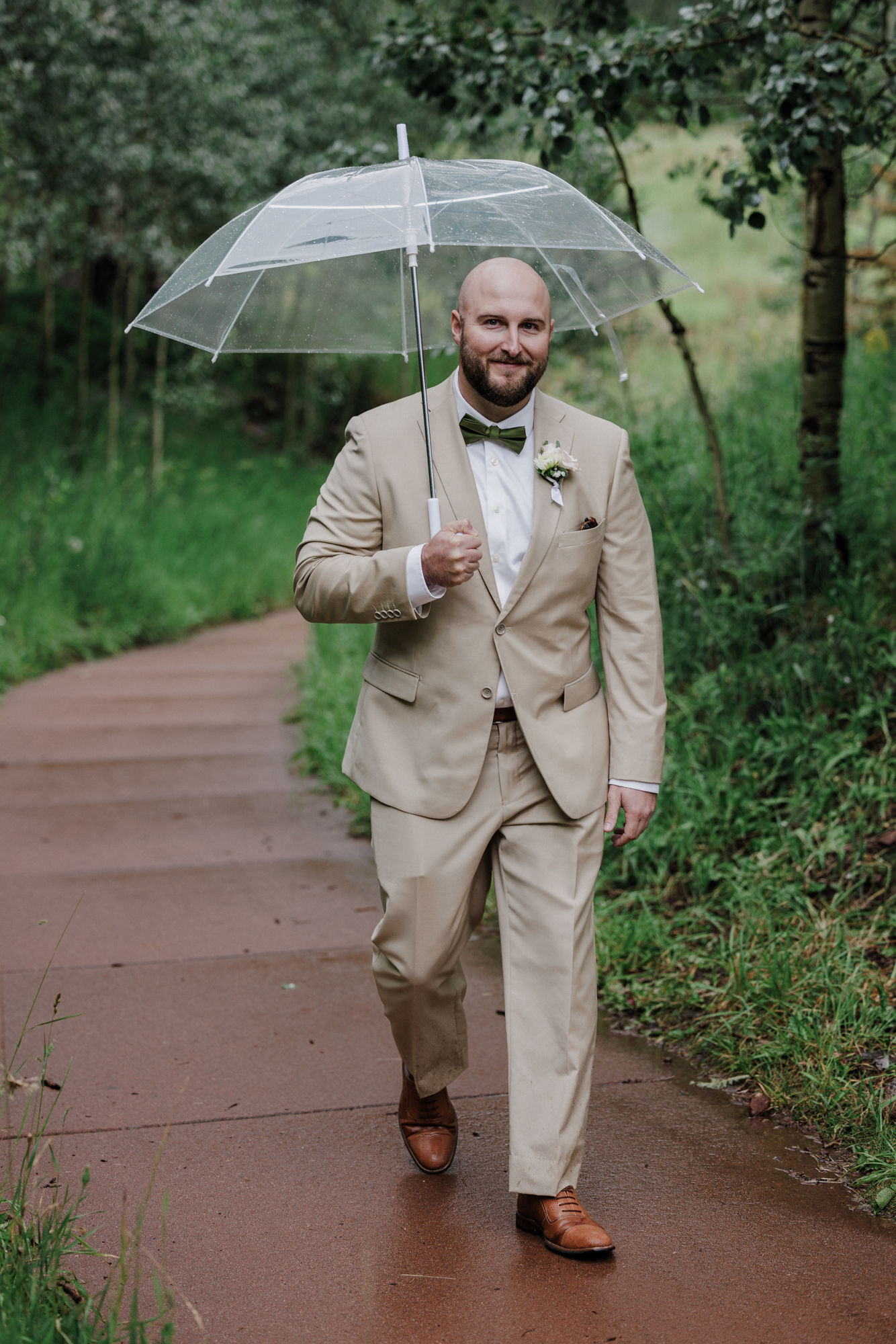 groom walks down aisle at maroon bells amphitheater during micro wedding