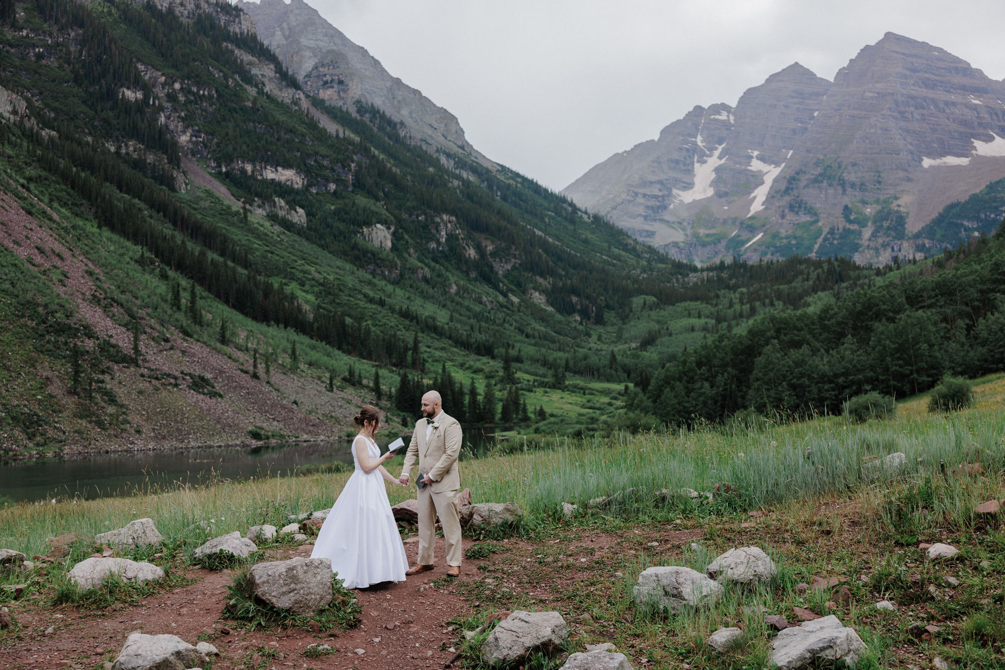 bride and groom say wedding vows at maroon bells amphitheater