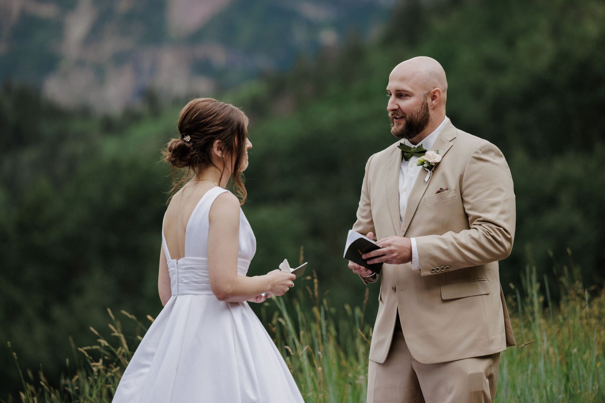 bride and groom say wedding vows during maroon bells aspen micro wedding