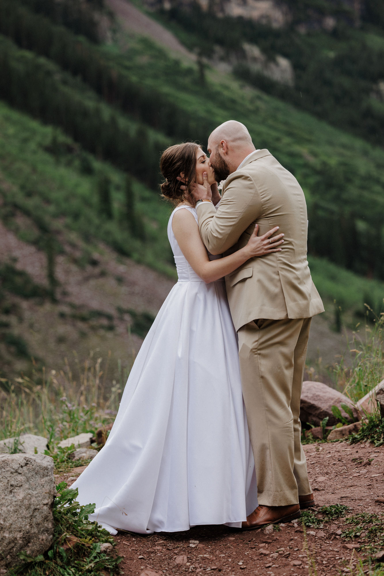 bride and groom kiss at the end of their micro wedding ceremony at maroon bells colorado