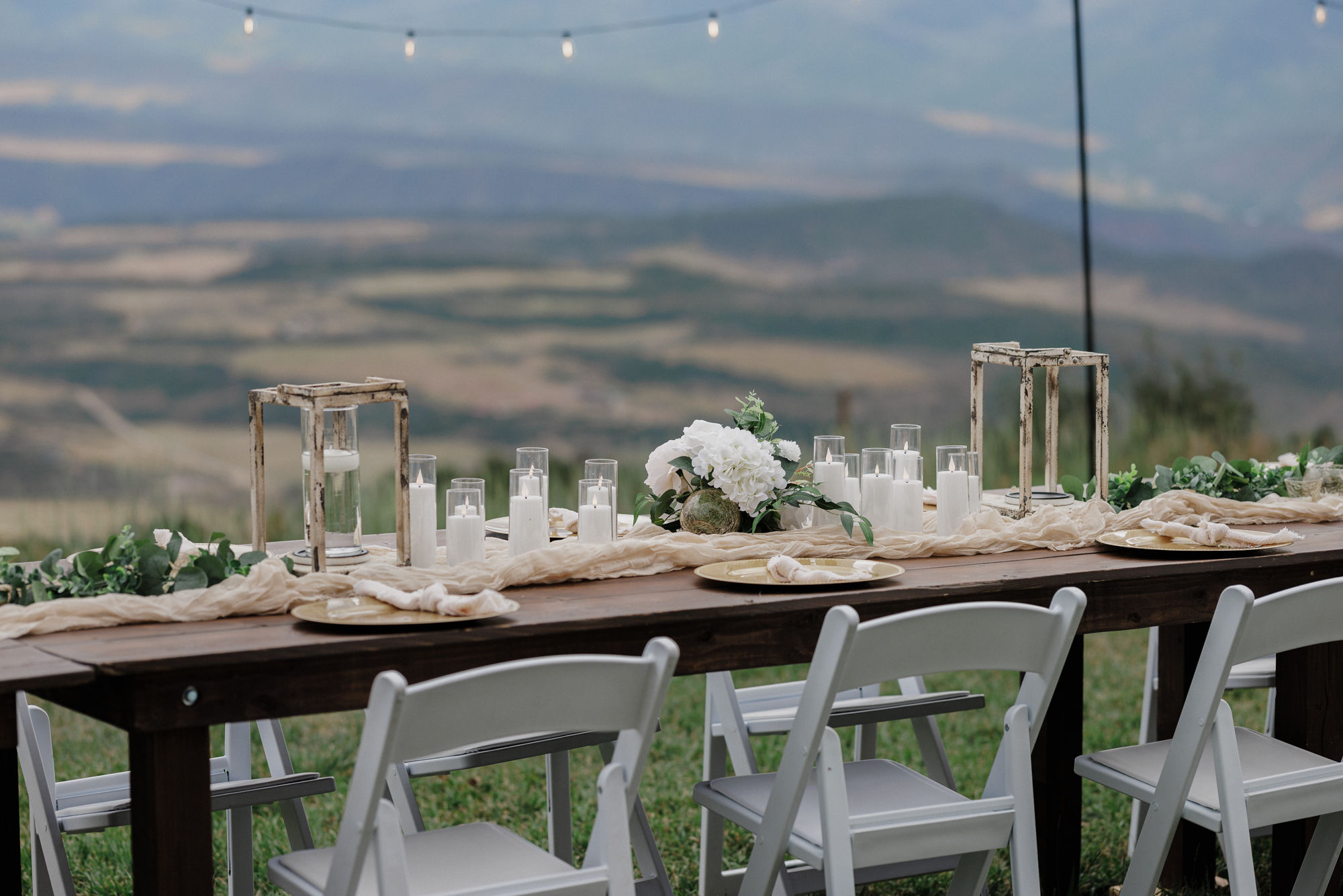 dinner table set up with decor overlooking the colorado mountains