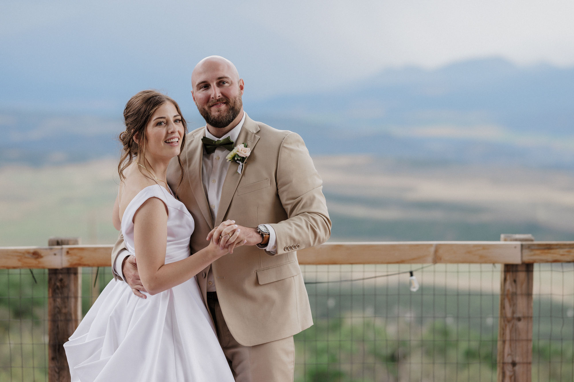 bride and groom dance on the deck of colorado airbnb wedding venue