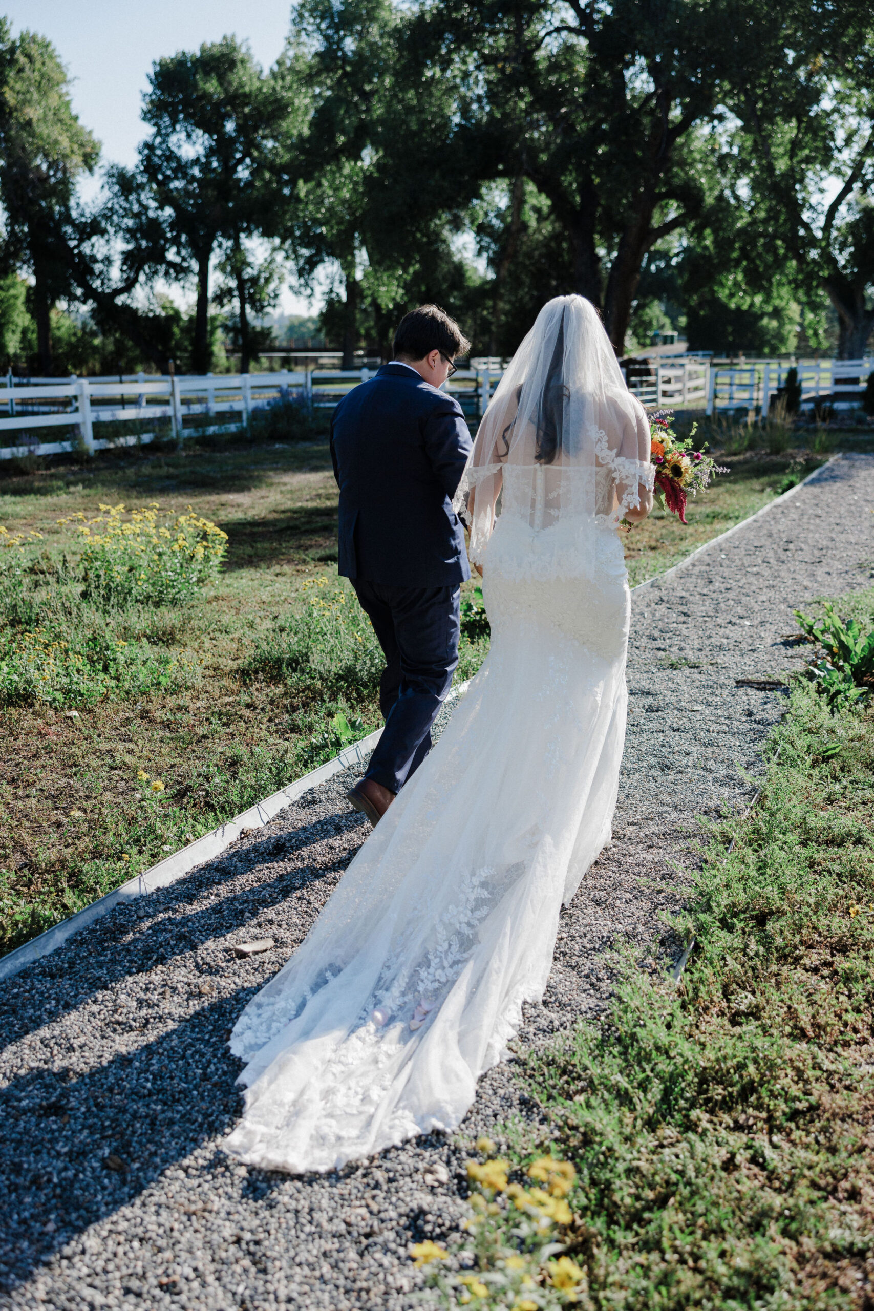 lgbtq+ couple walks down aisle after intimate wedding ceremony