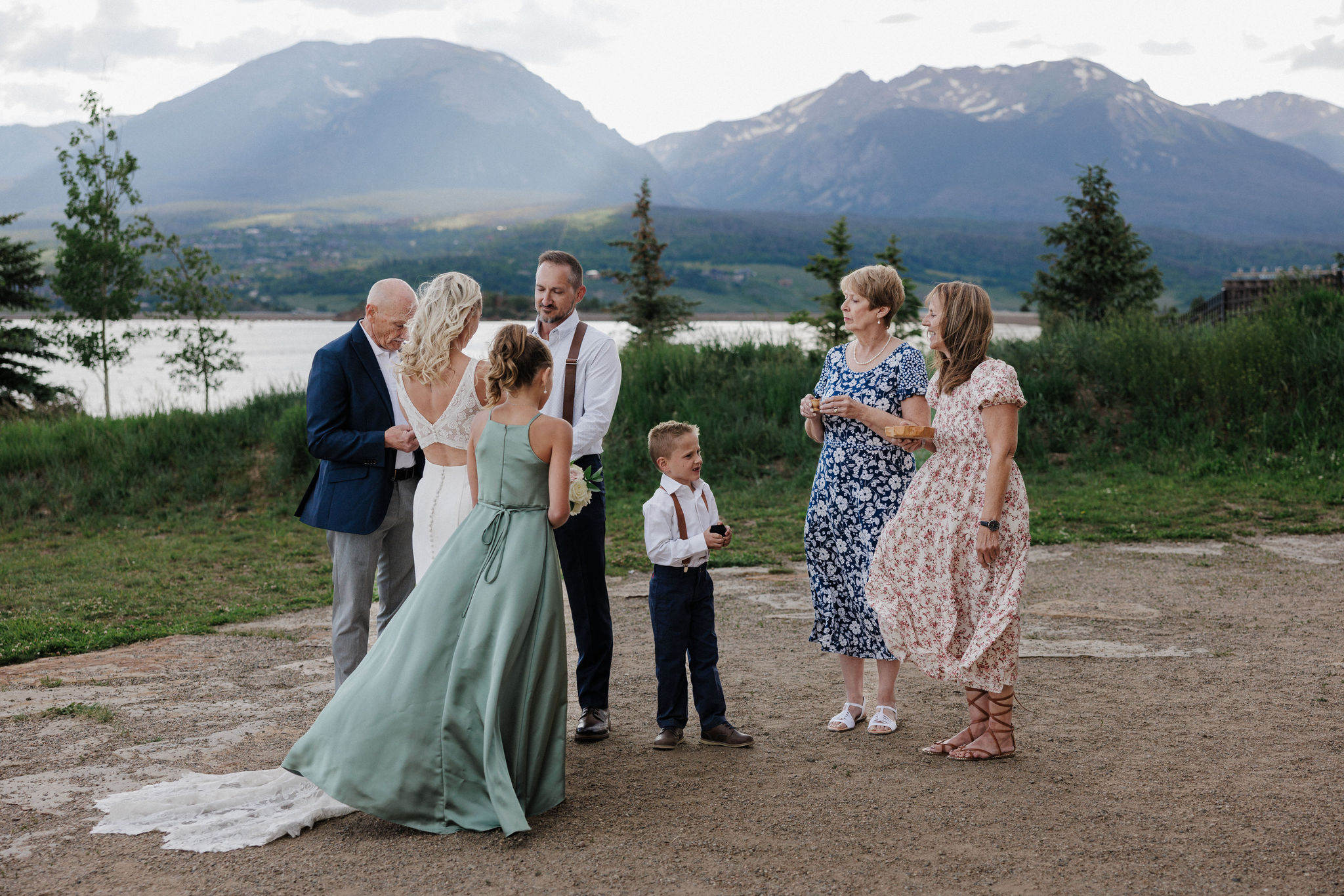 family gathers during micro wedding ceremony at dillon marina park pavilion in breckenridge