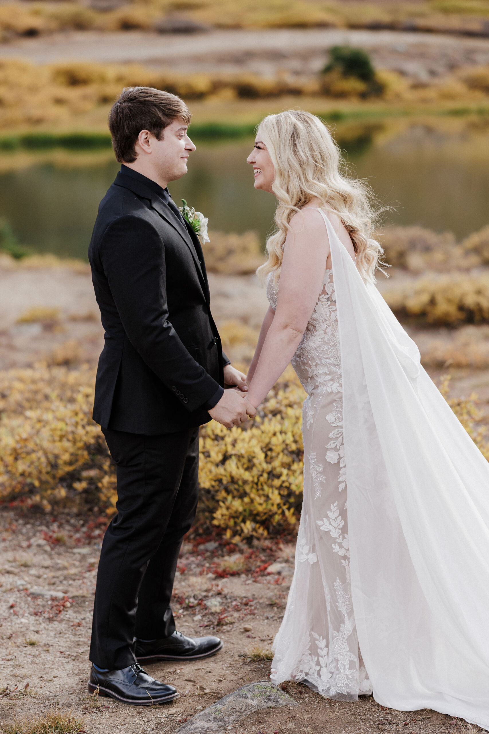 bride and groom pose for colorado wedding photographer