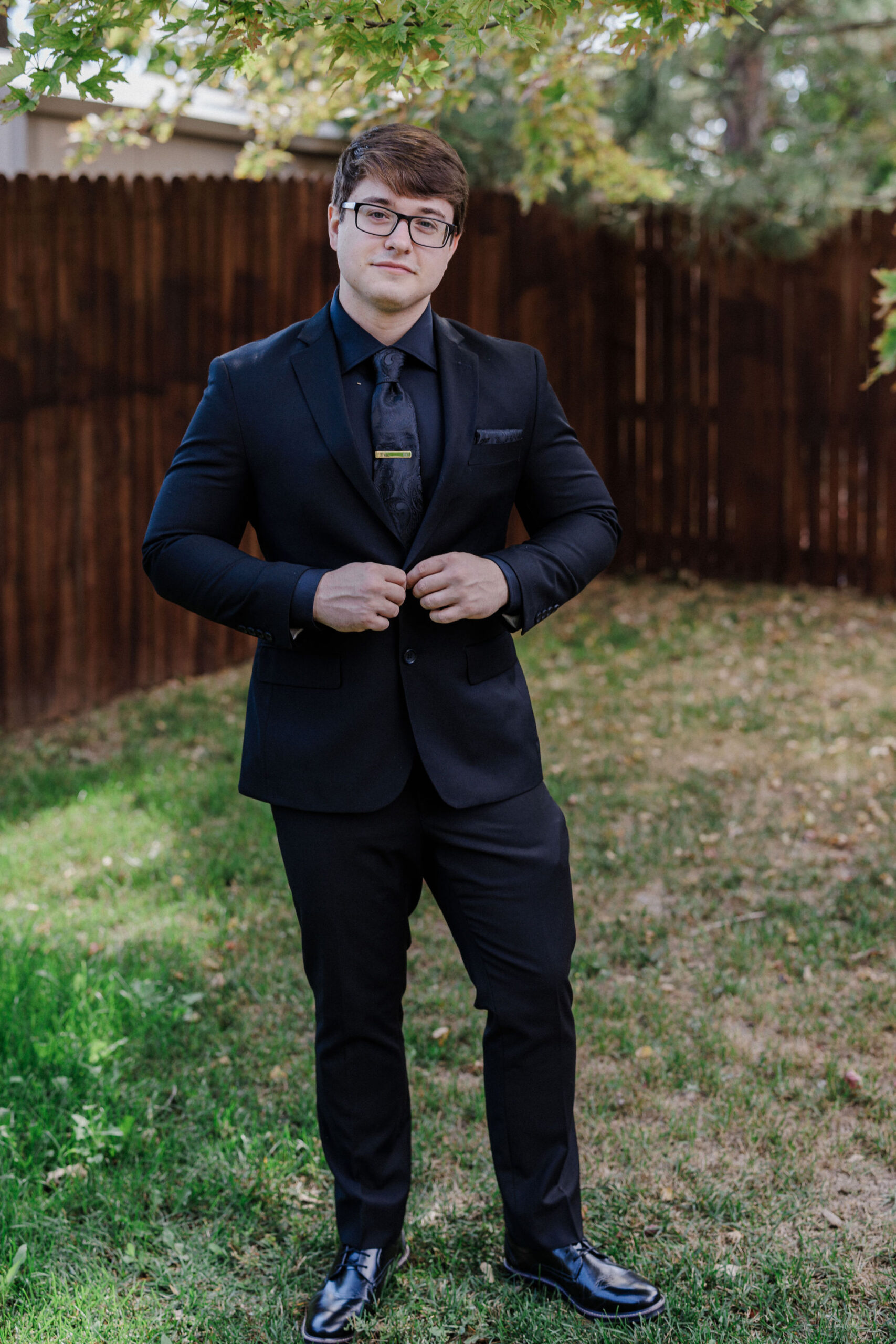 groom poses for colorado micro wedding photographer