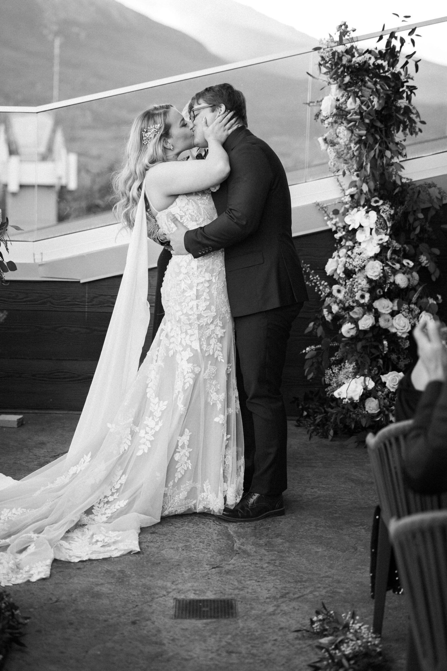 bride and groom kiss during micro wedding ceremony