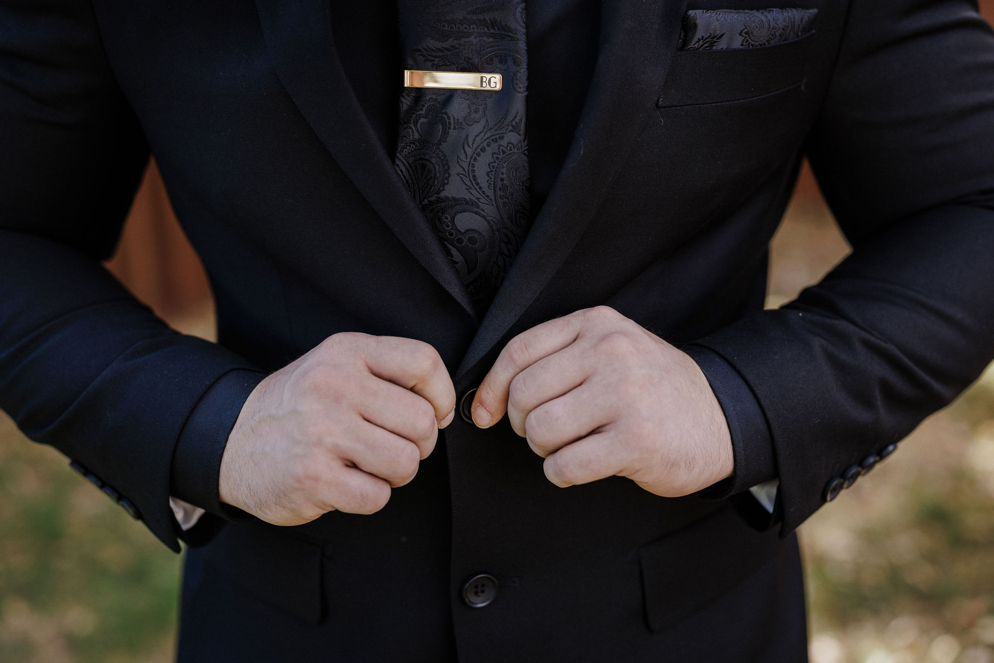 close up image of groom's suit