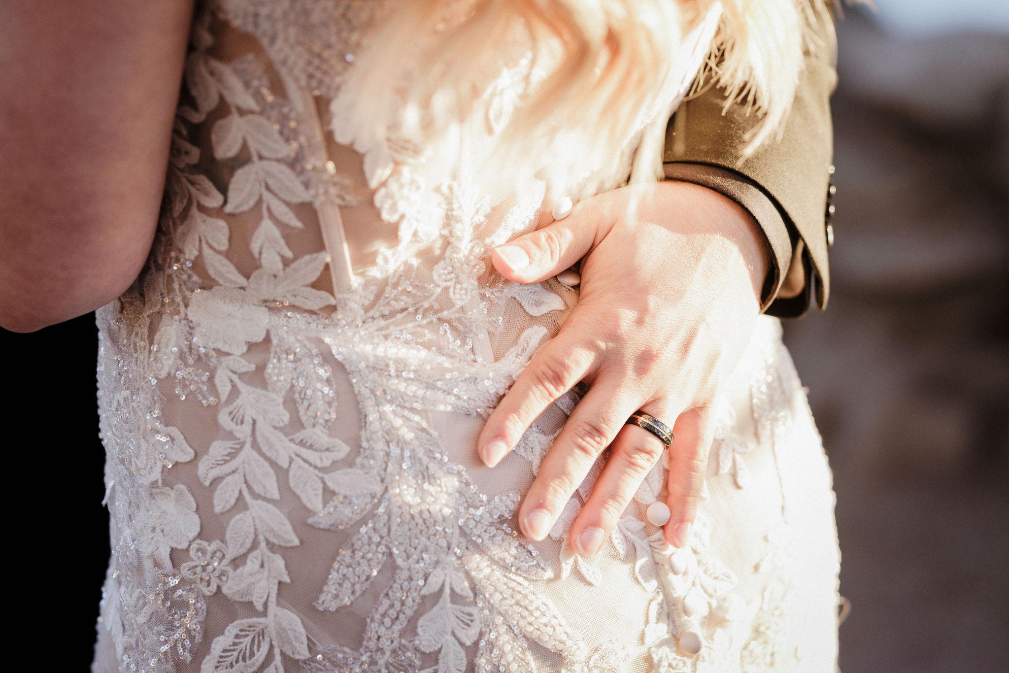 groom rests hand on brides back