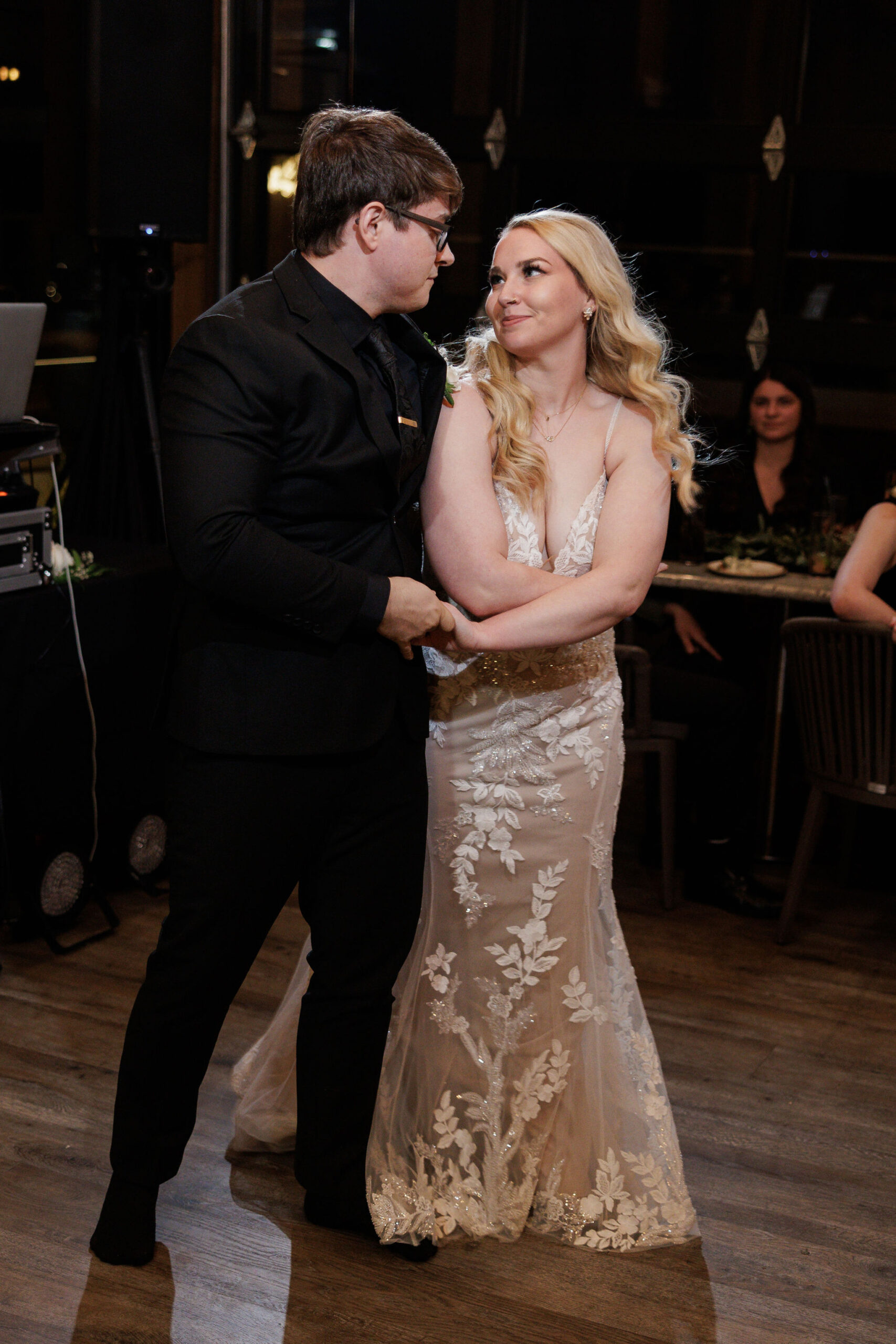 bride and groom dance during micro wedding reception