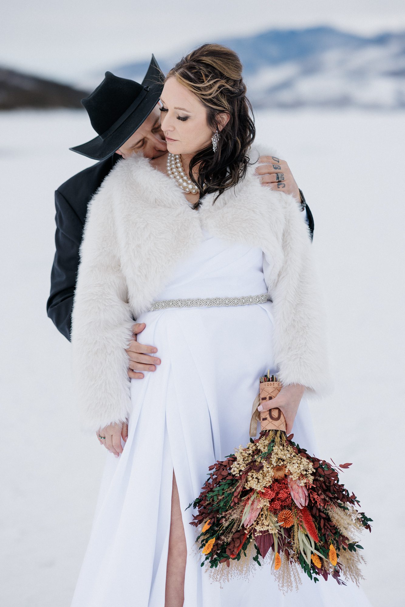 Bride and groom celebrate winter elopement at Lake Dillon.