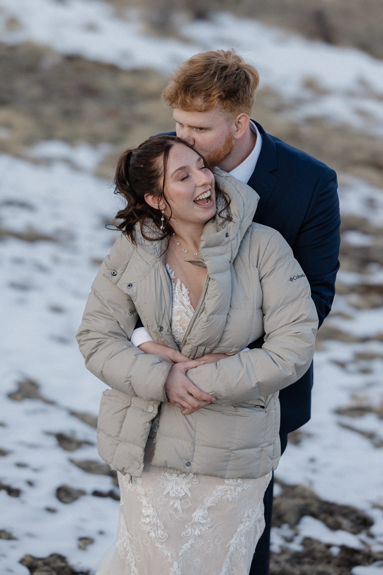 Bride and groom laugh during sunset portraits at vrbo wedding venue in colorado
