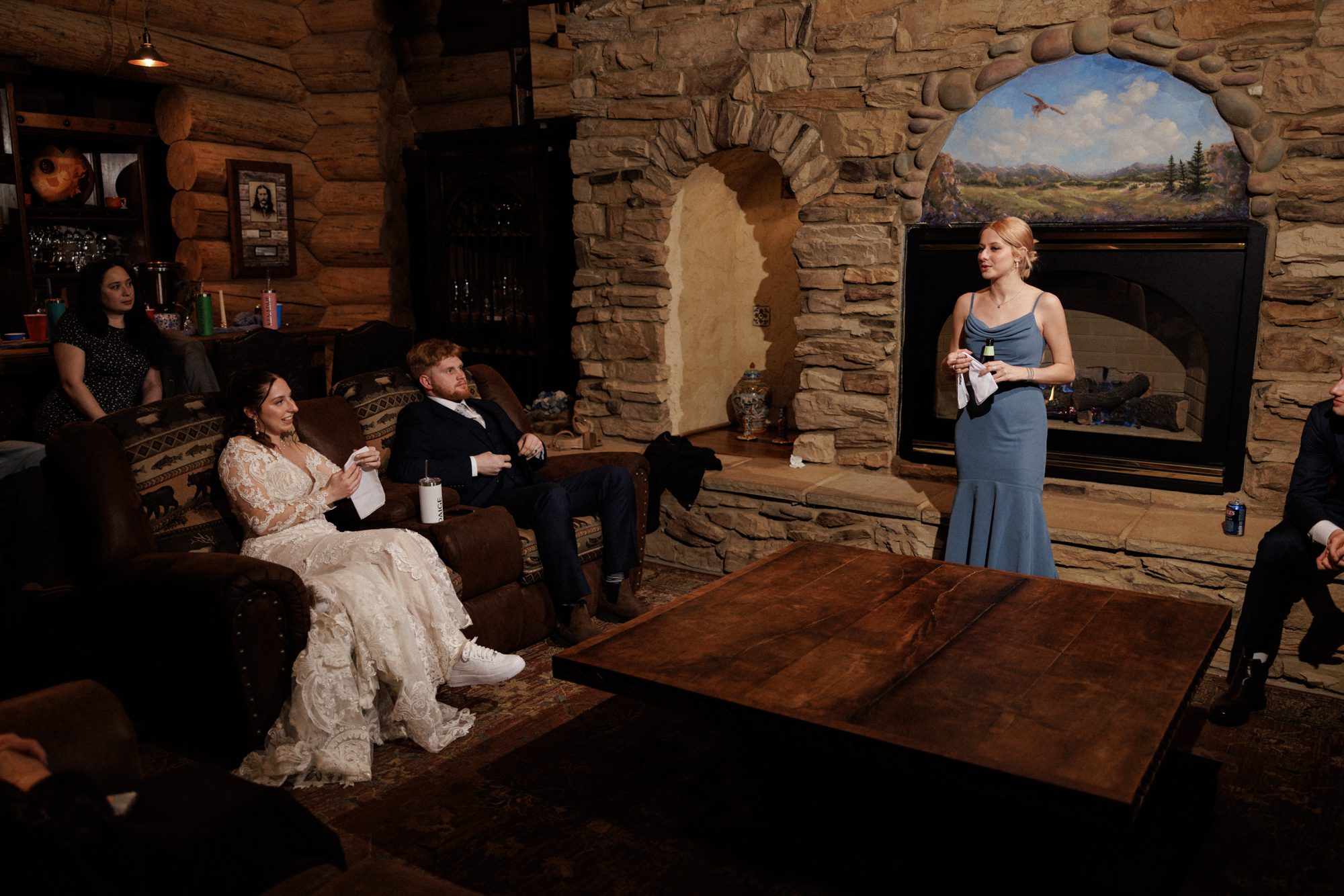 Bride and groom listen to toasts at Airbnb wedding.