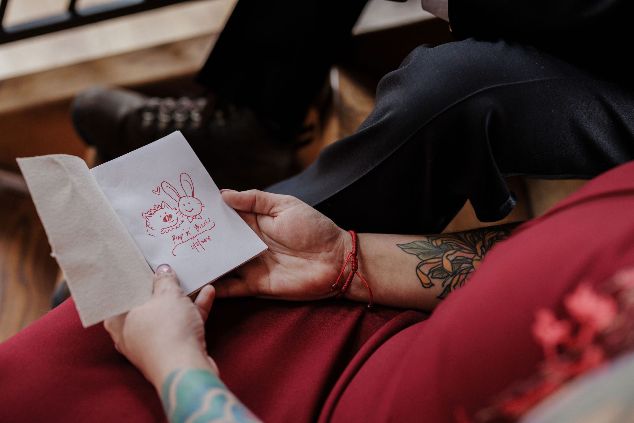 bride holds hand made wedding vow books