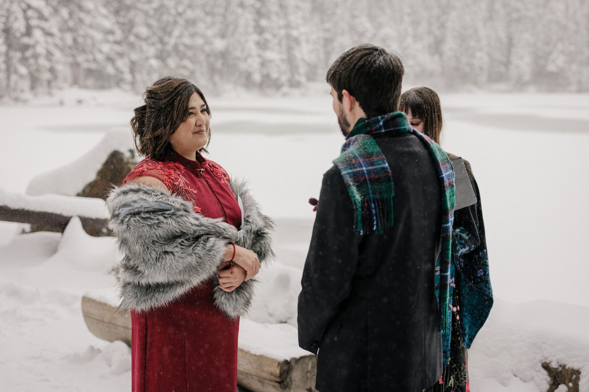 bride and groom say wedding vows during colorado winter elopement at rocky mountain national park
