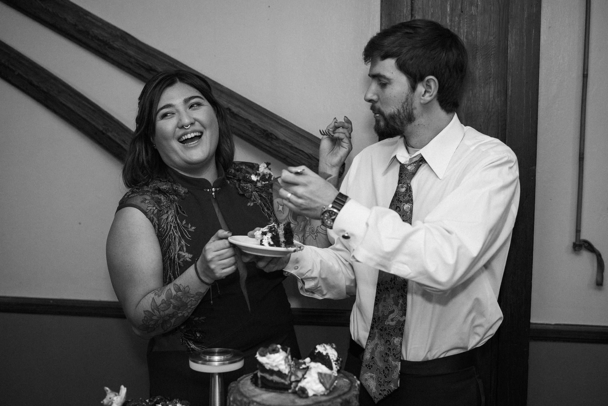 bride and groom feed each other elopement cake