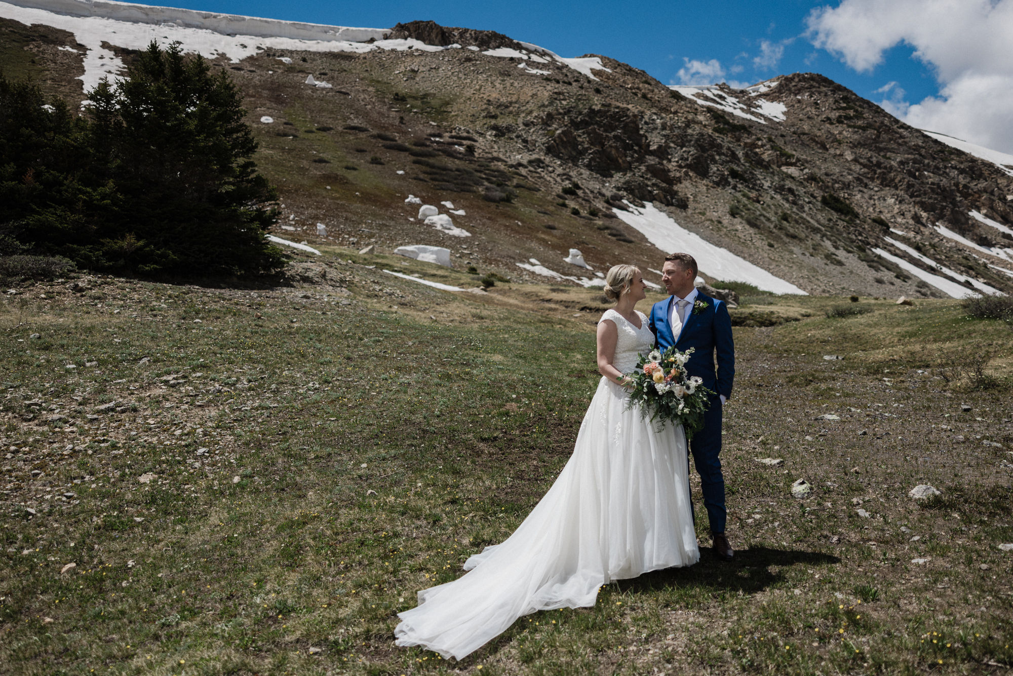 Bride and groom pose for denver photographer during colorado state park wedding