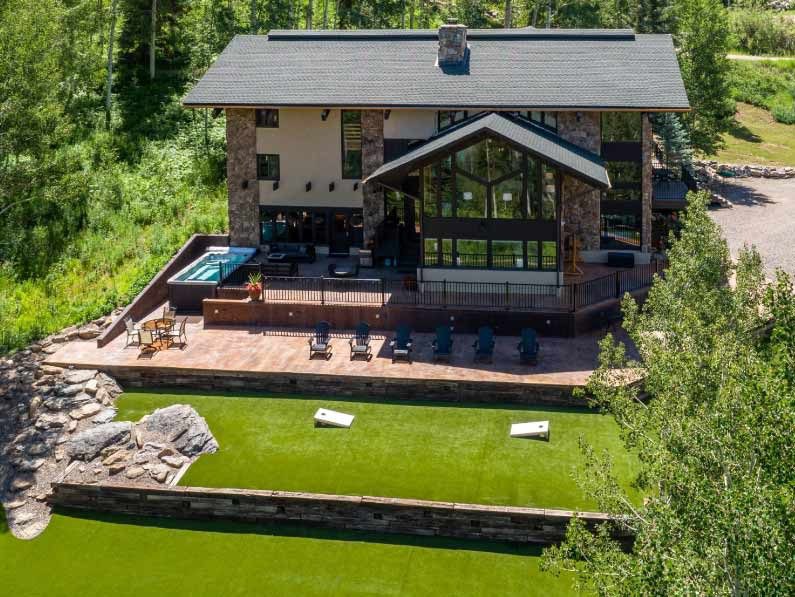 vrbo used for colorado forest weddings - view of the back lawn 