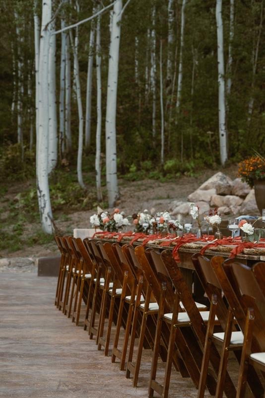 vrbo used for colorado forest weddings - view of reception dinner table outside