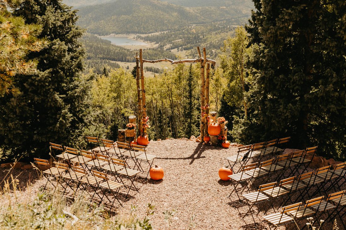 A-frame structure sits on a hill in the colorado forest, used for micro weddings and elopements