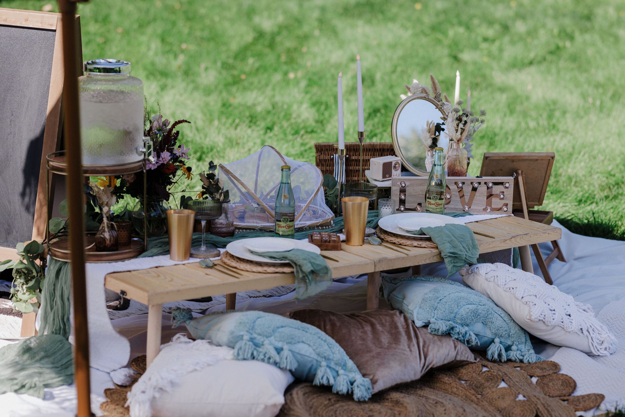 luxury picnic is set up for a mountain micro wedding by the mountains in colorado