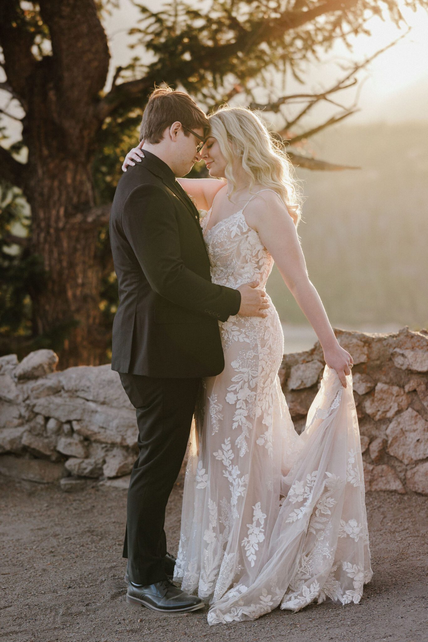 bride and groom slow doance during golden hour in the mountains in the fall