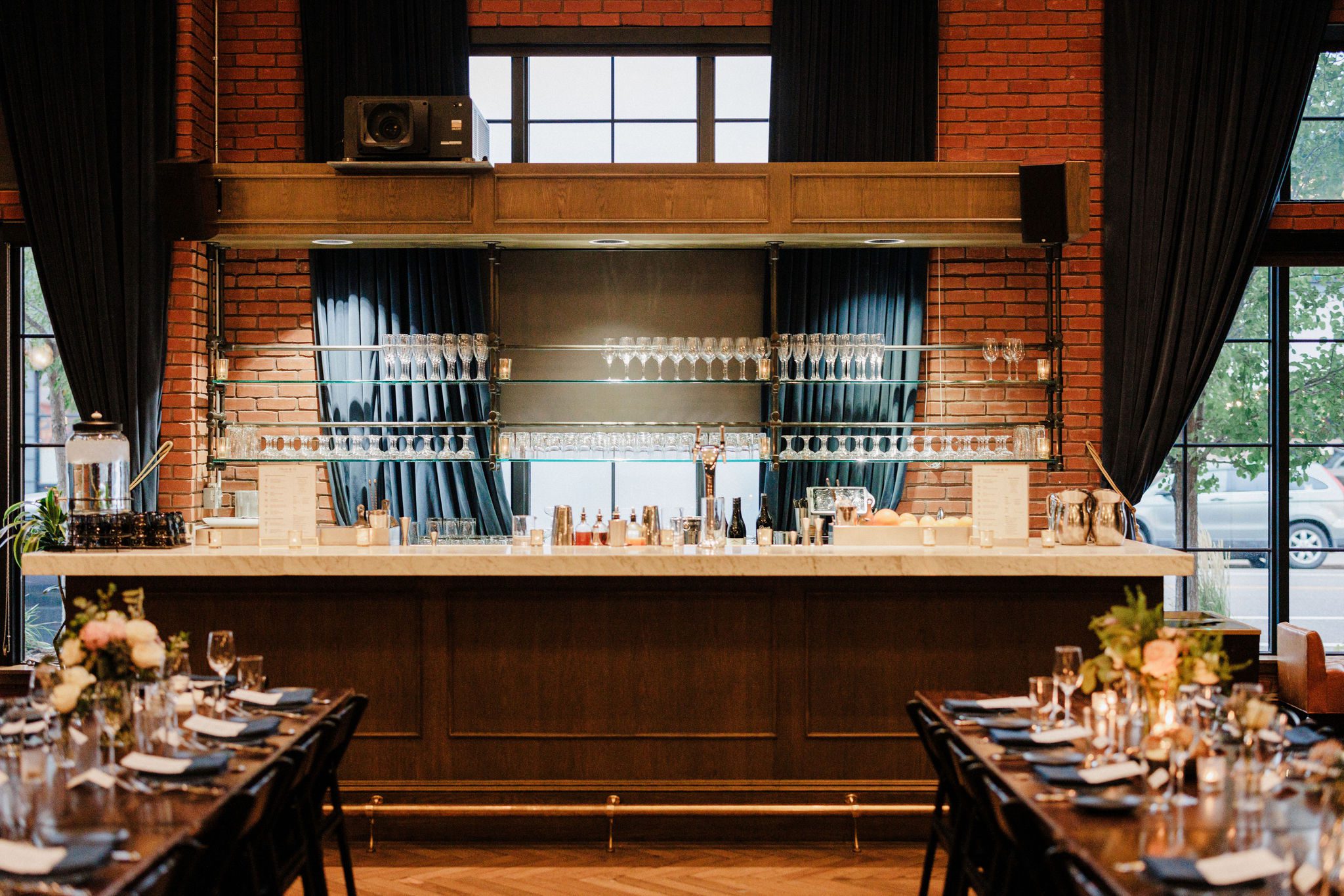 the wedding venue's hotel bar is set up for a summer wedding in denver colorado