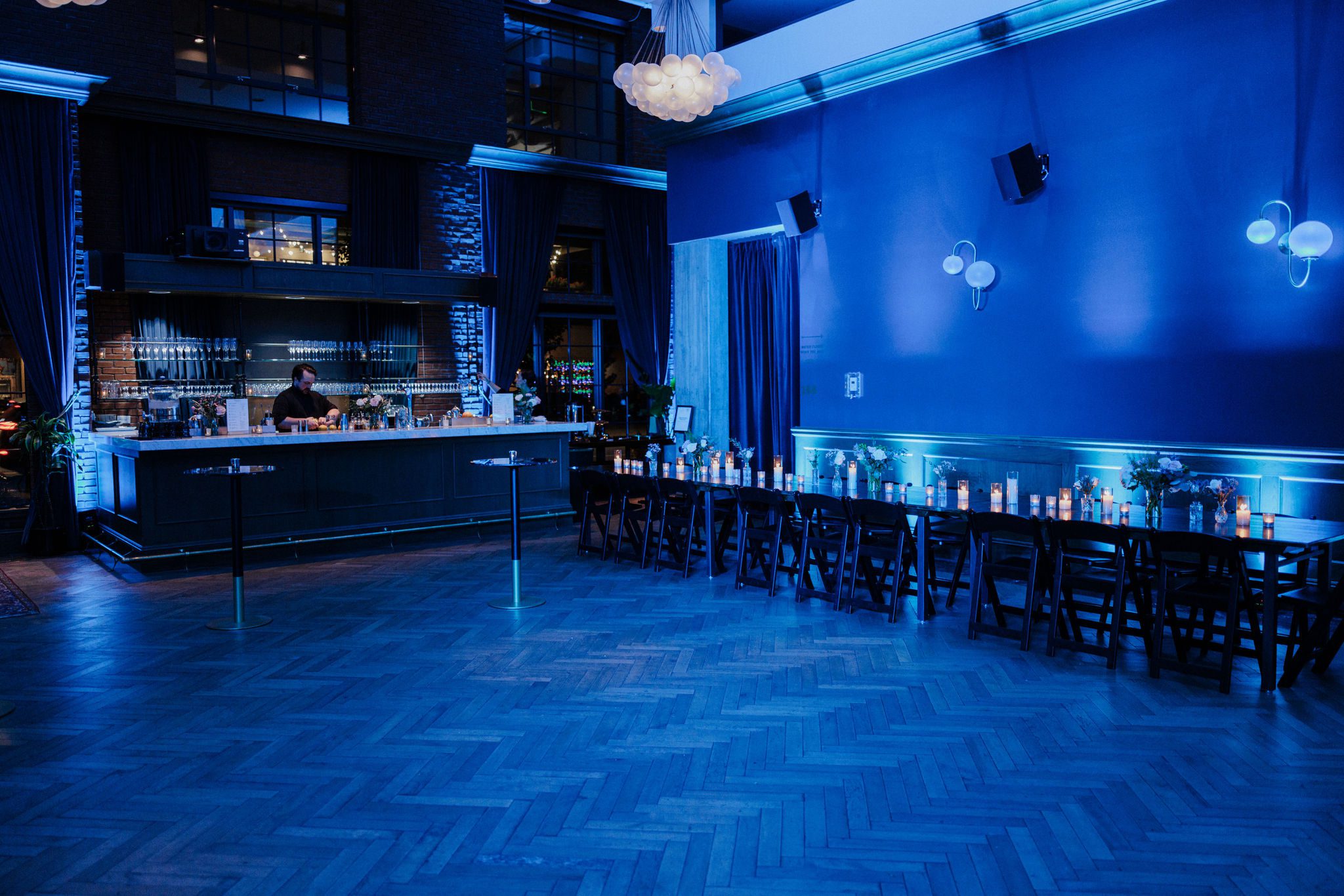 dancefloor at a denver summer wedding venue is lit up blue for reception