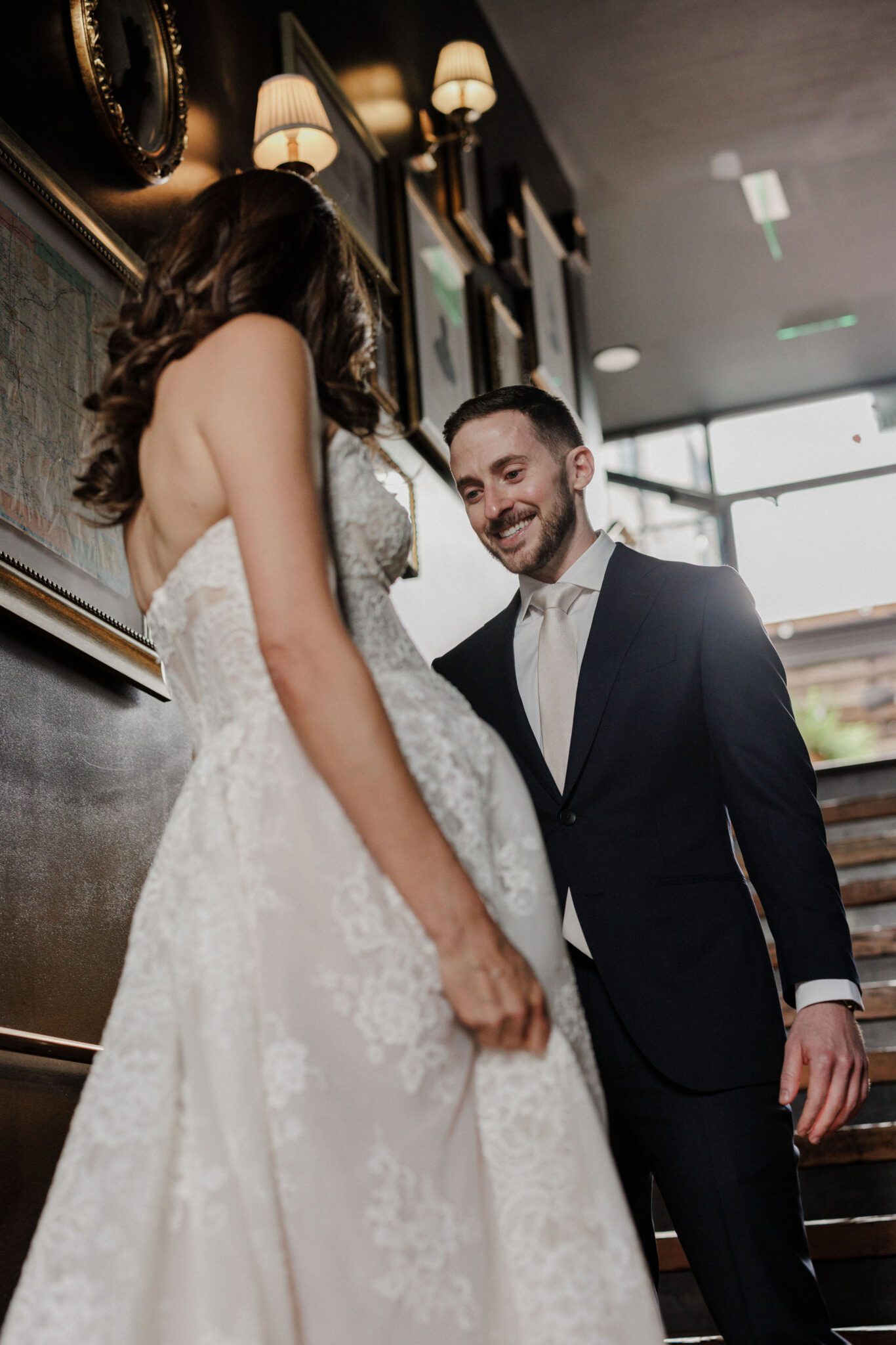 groom sees his bride for the first time before wedding ceremony at the ramble hotel