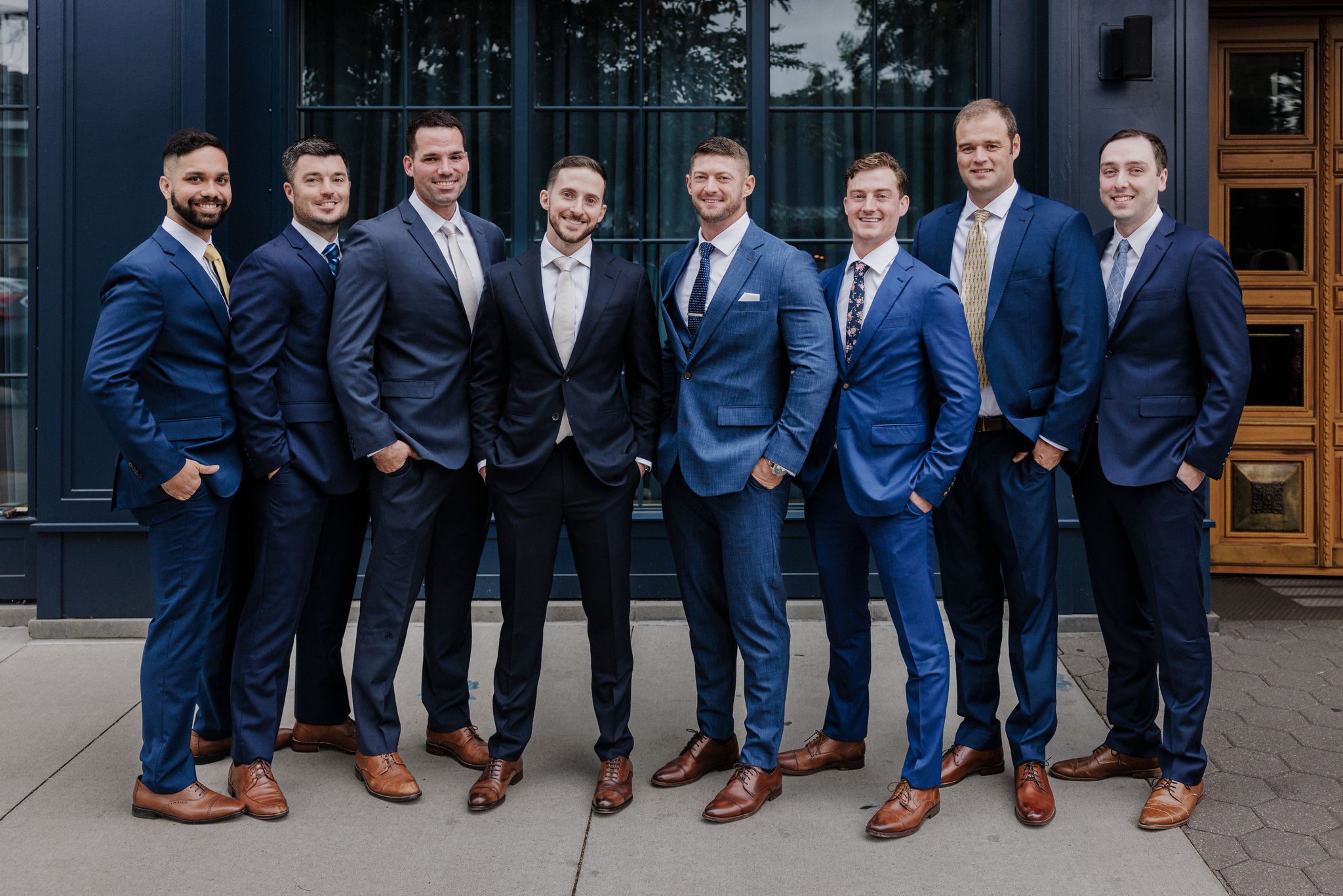 groom and groomsmen stand in front of denver micro wedding venue, the ramble hotel