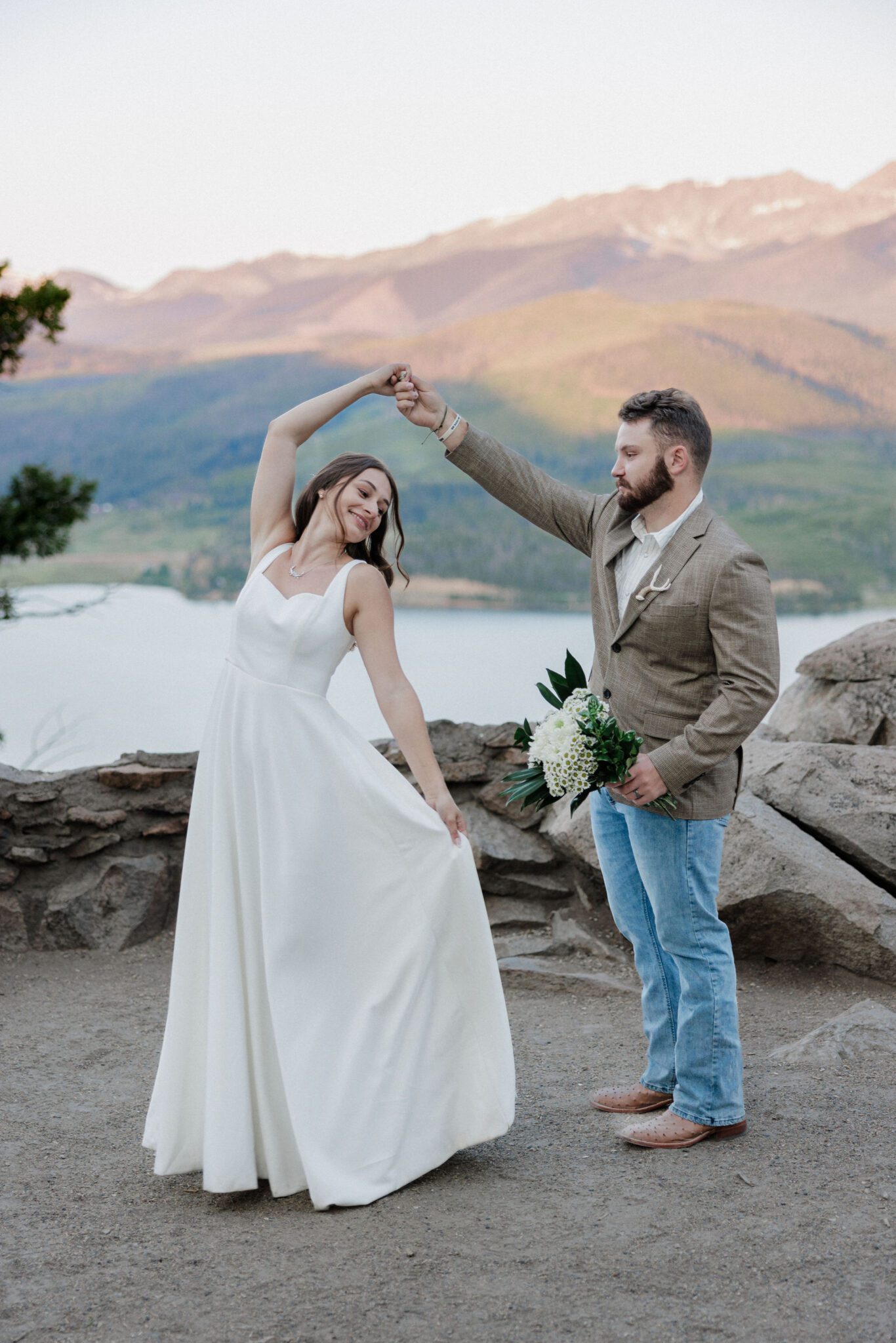 bride and groom dance at sunrise after elopement ceremony