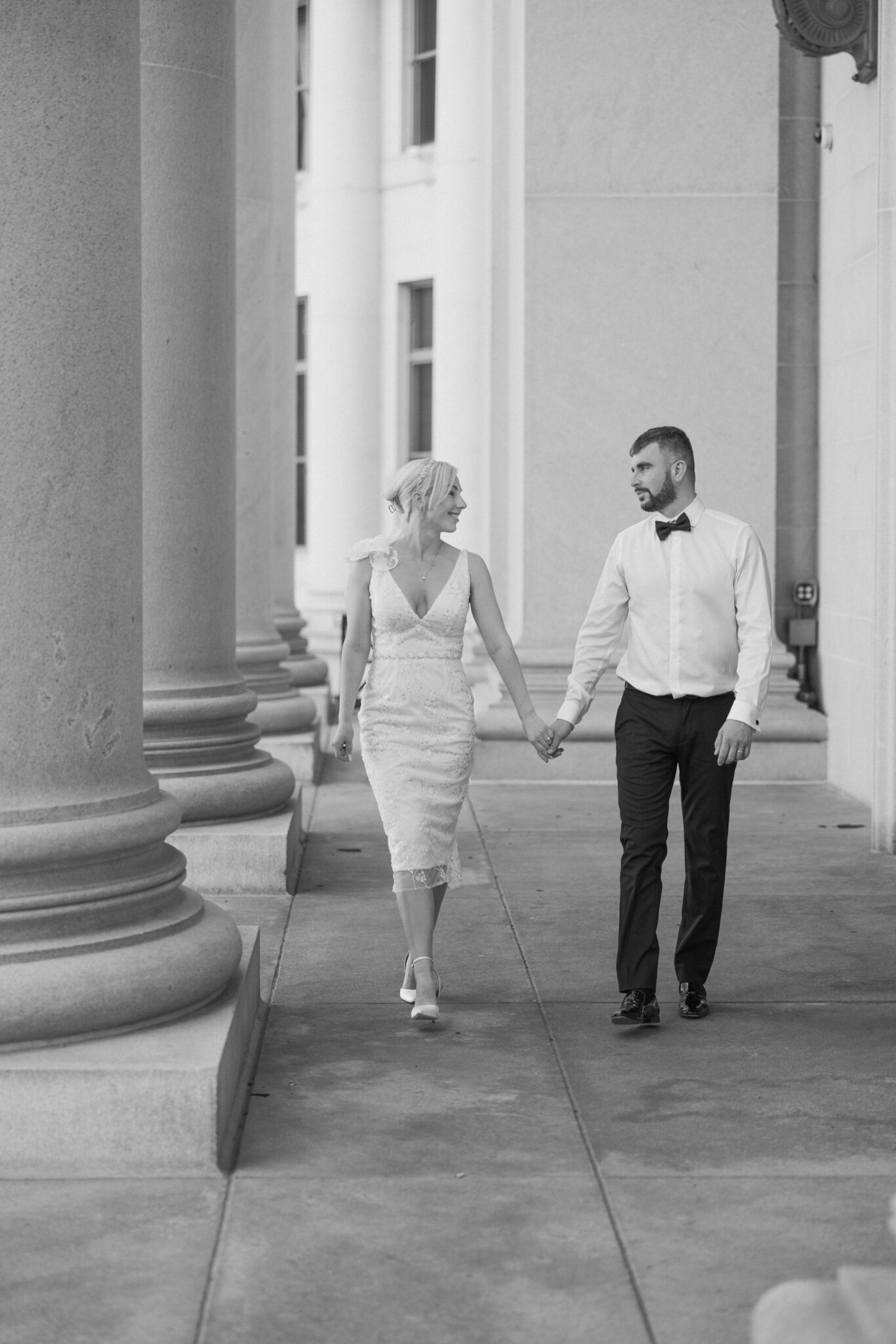 bride and groom embrace the elopement meaning by getting married at a denver courthouse
