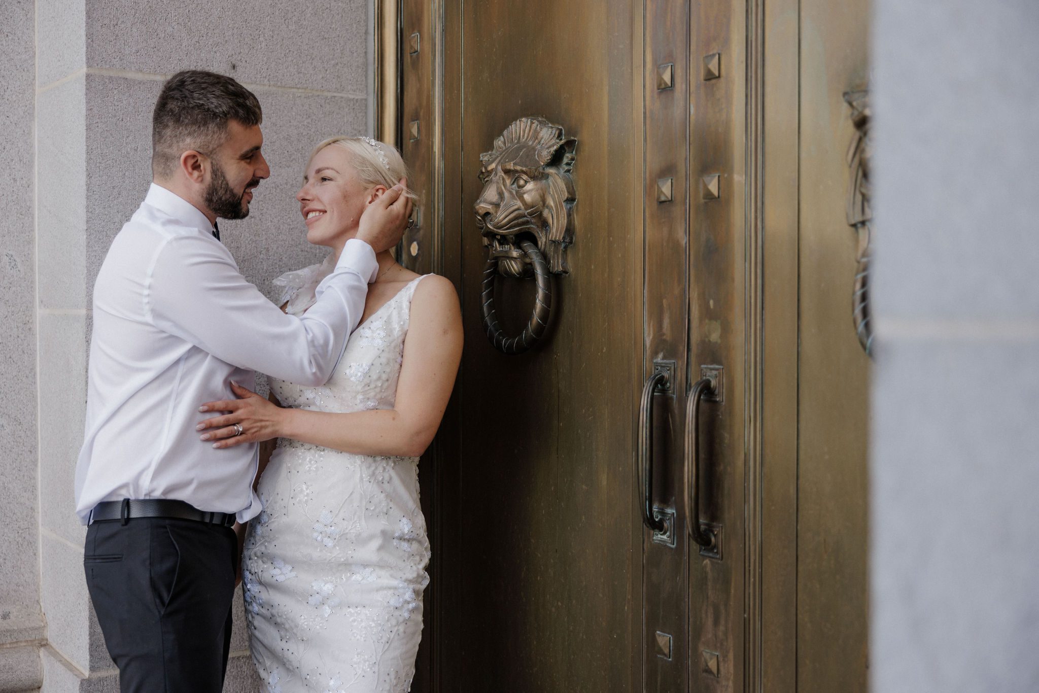 bride and groom pose for wedding photogrpaher during denver elopement