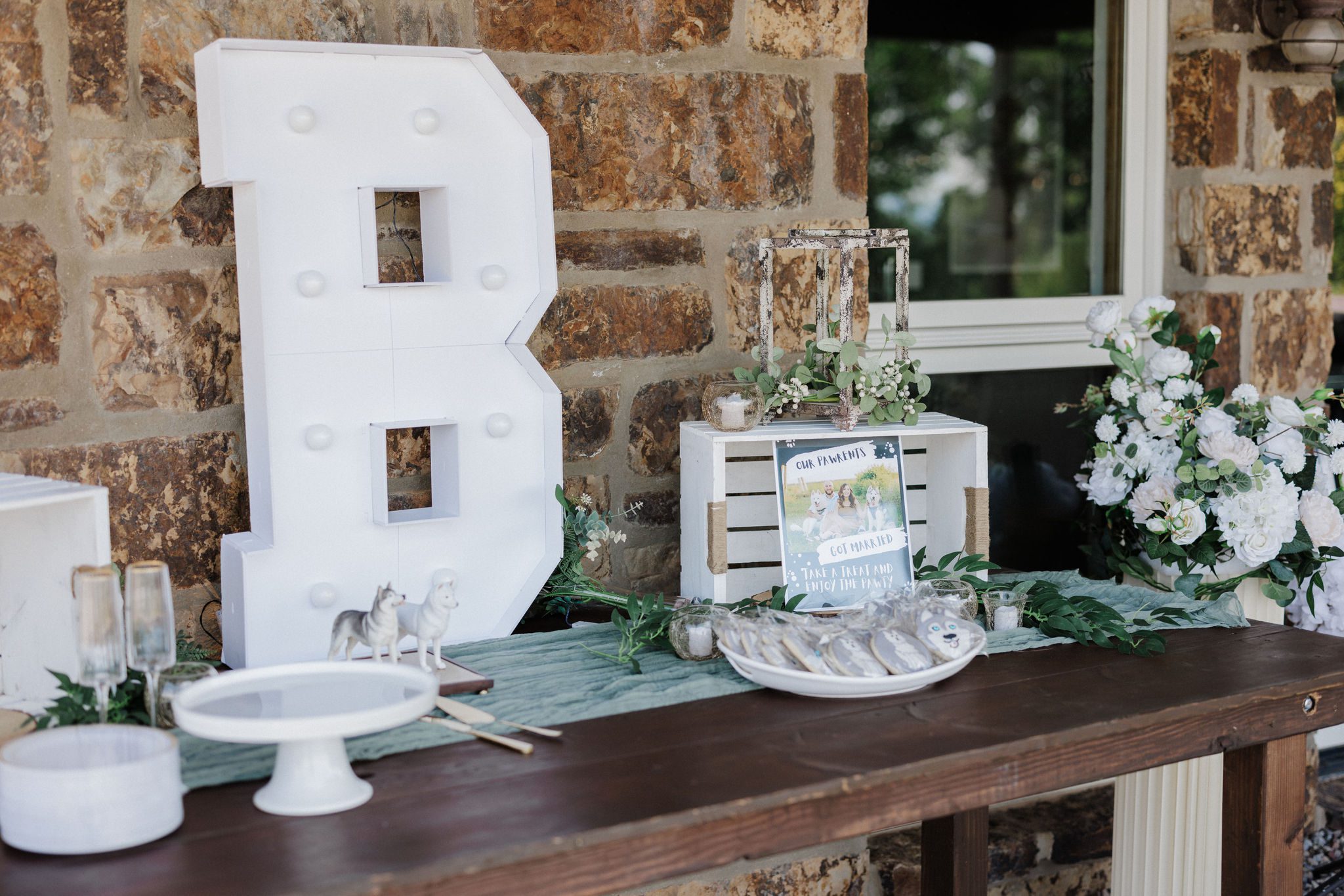 closeup of backyard wedding welcome table