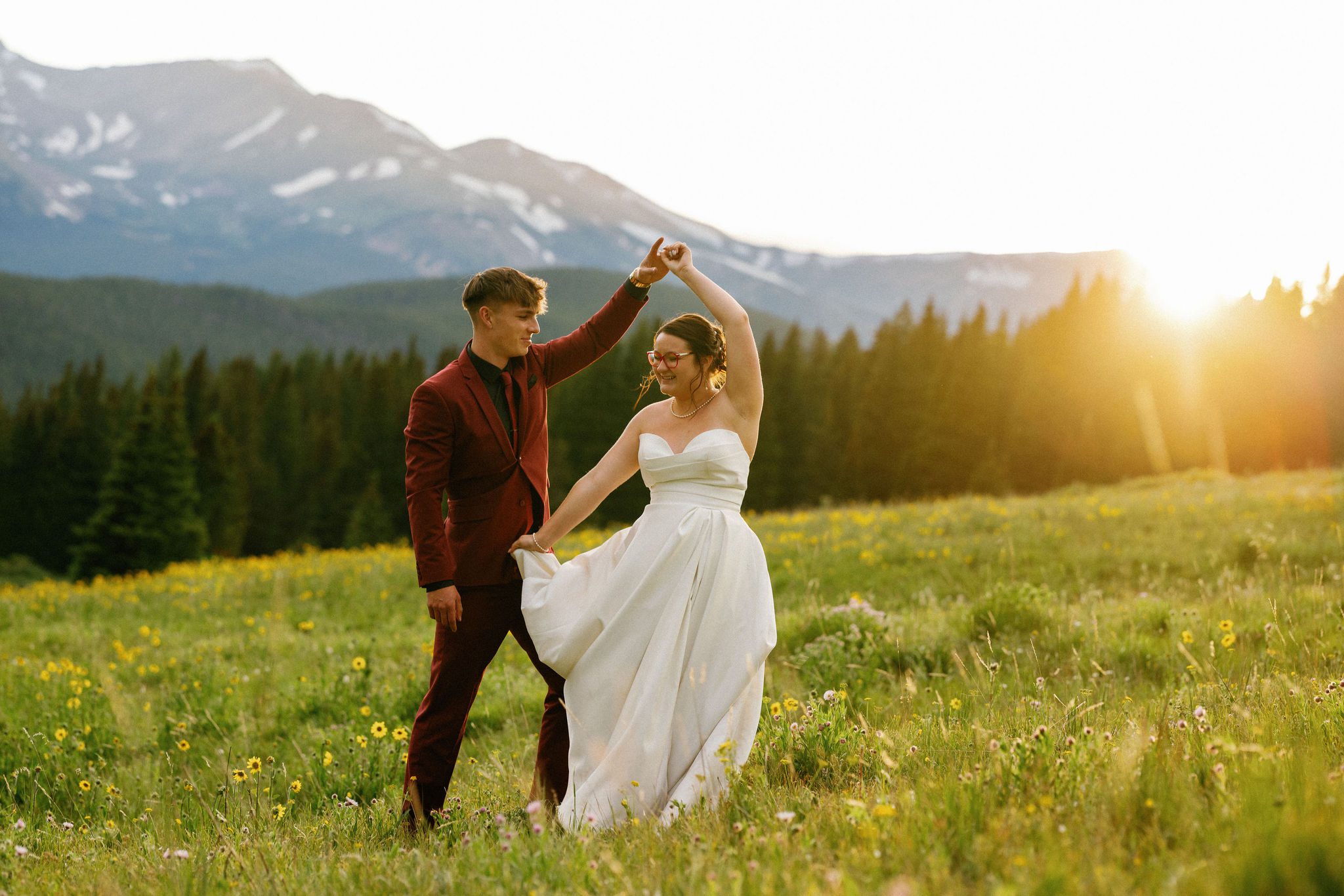 man and woman dance during sunset photos at popular colorado engagement location