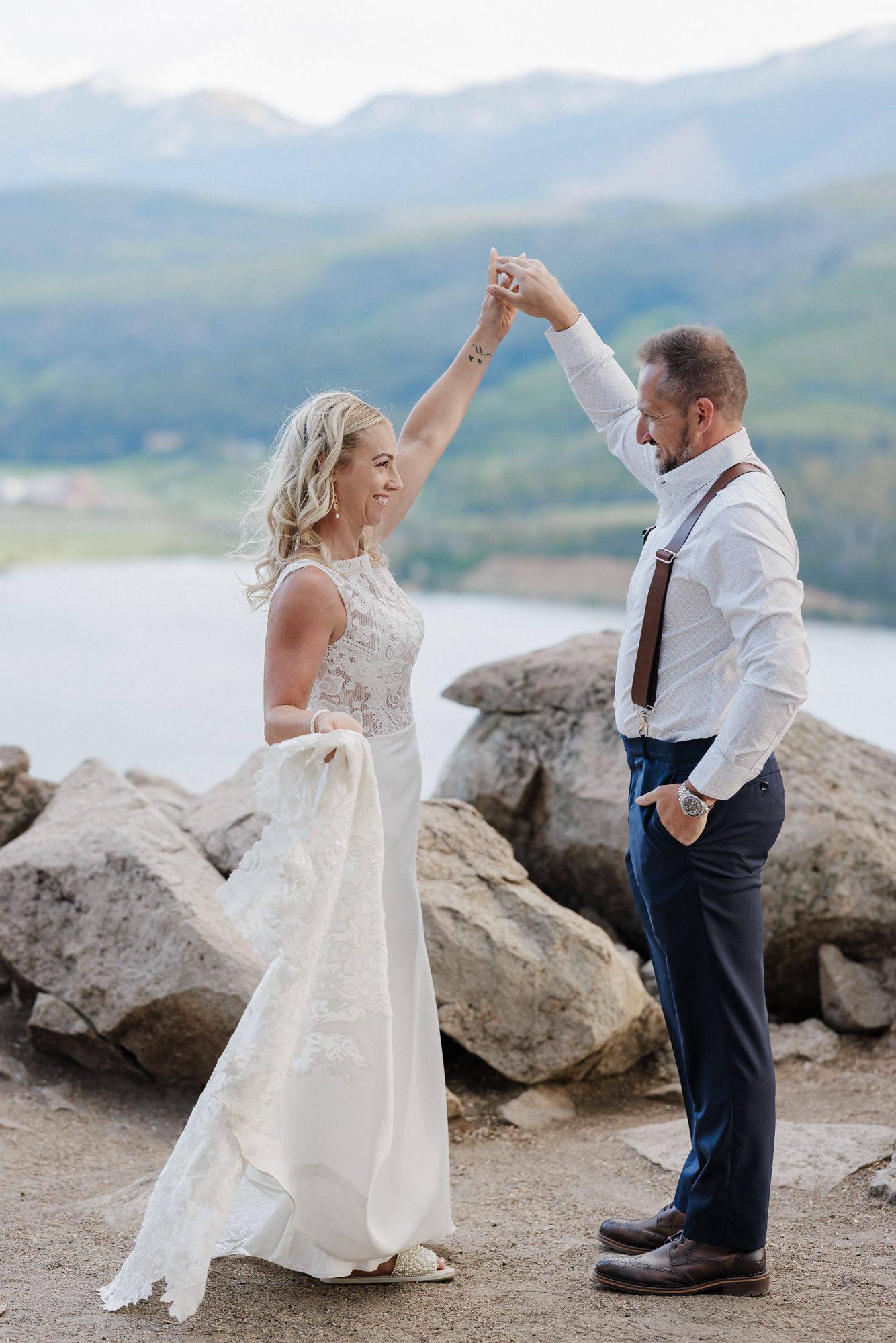 groom twirls bride during summer wedding, the best time to get married