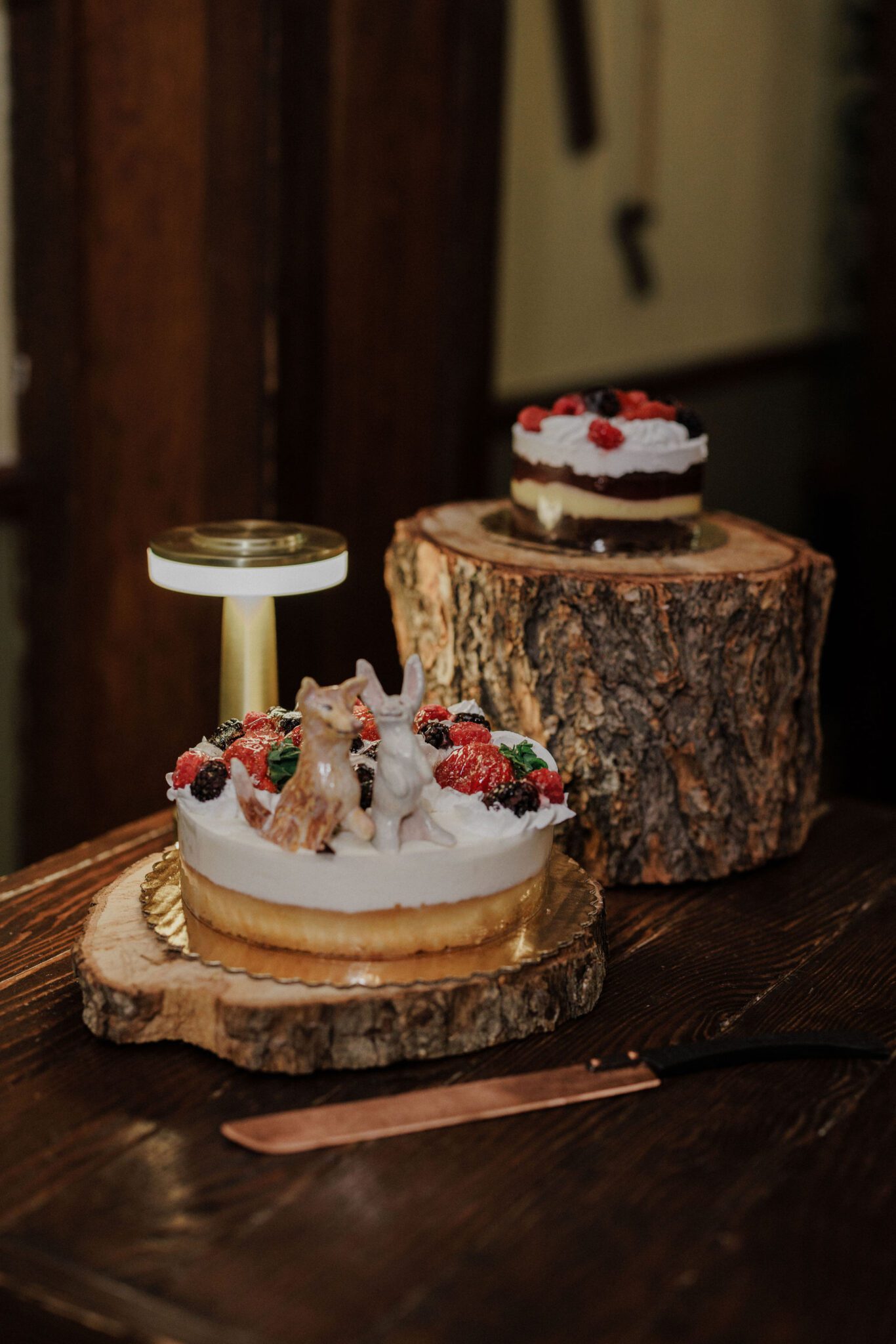 wedding cakes, made by elopement vendor, a baker, sit on table during reception