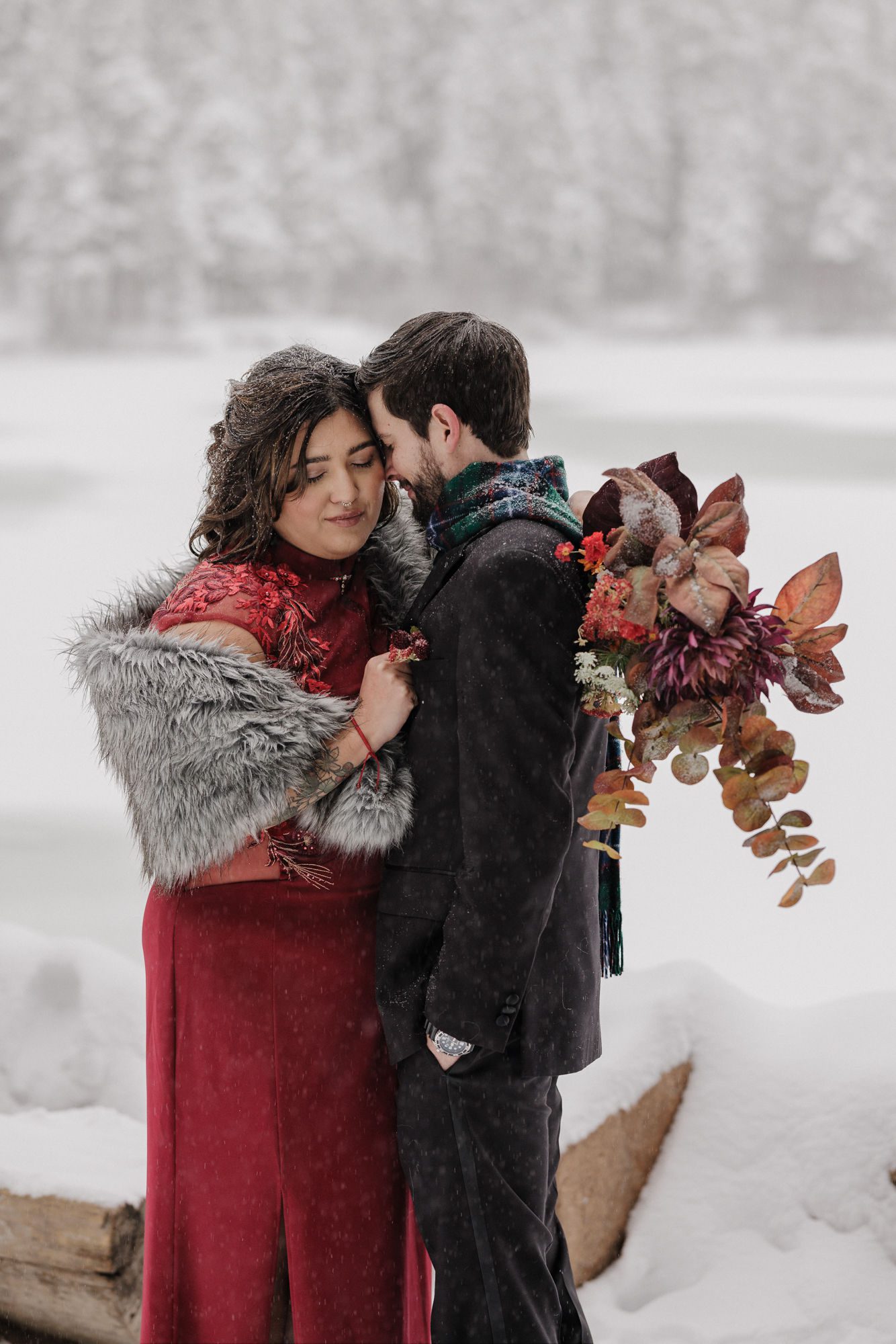 bride and groom pose for wedding photographer during elopement photos