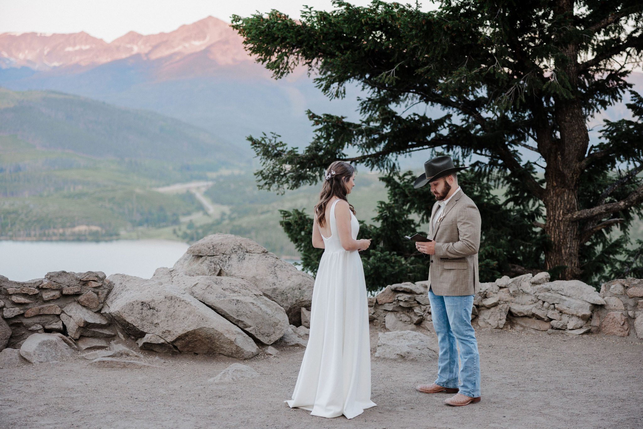 elopement planning: bride and groom say wedding vows at sapphire point overlook in colorado
