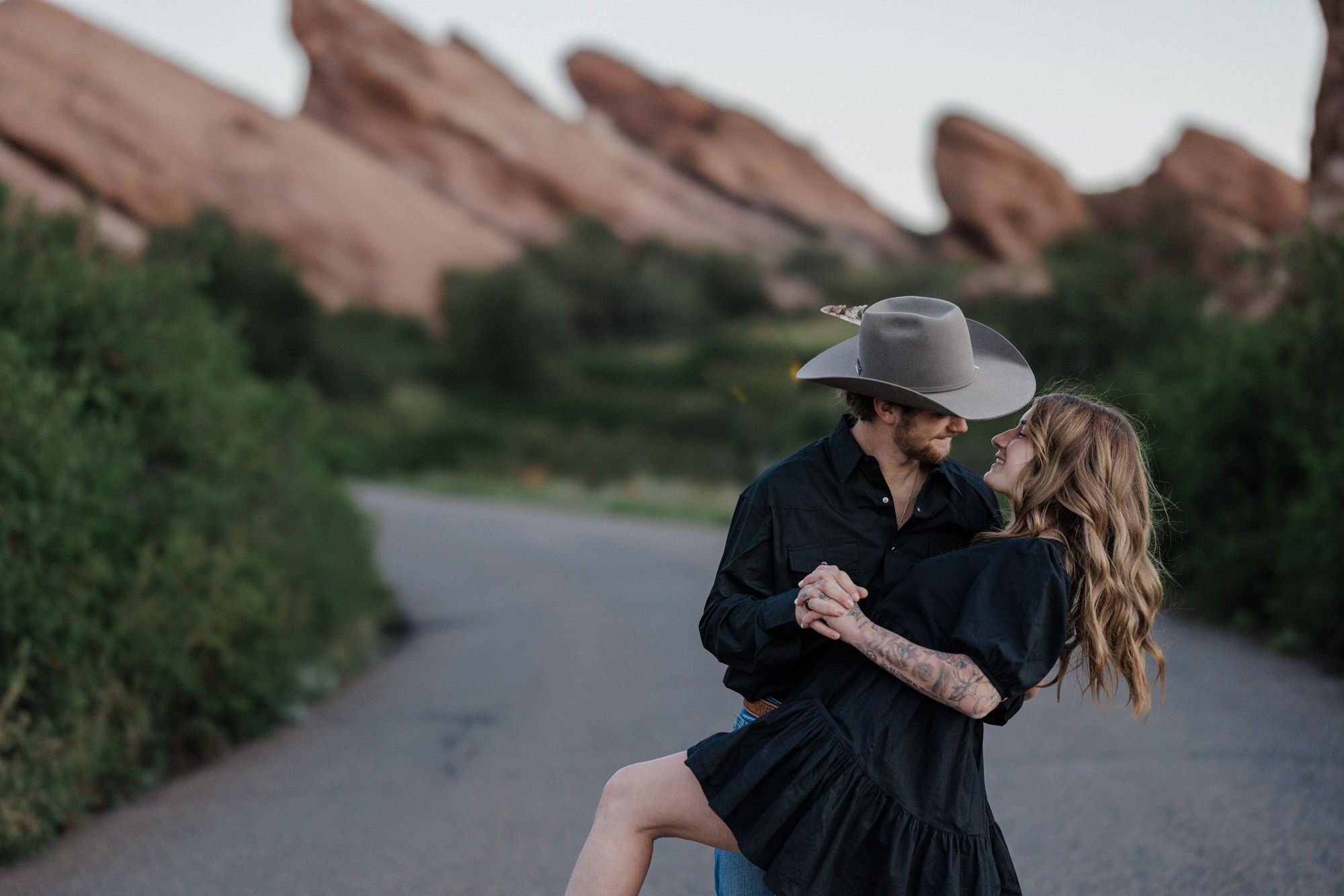 best place to propose in colorado: man dips woman during engagement photos