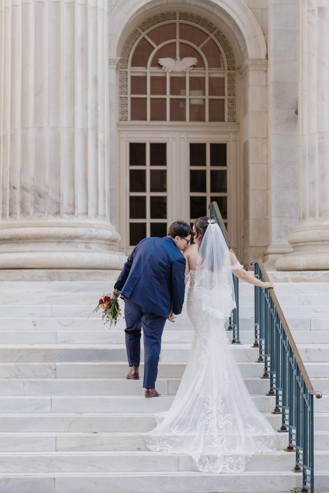 best place to propose in colorado: lgbtq couple walks up steps at byron white courthouse