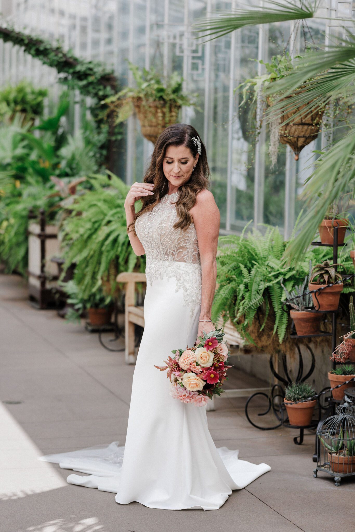 best place to propose in colorado: bride poses for photos at denver botanic gardens